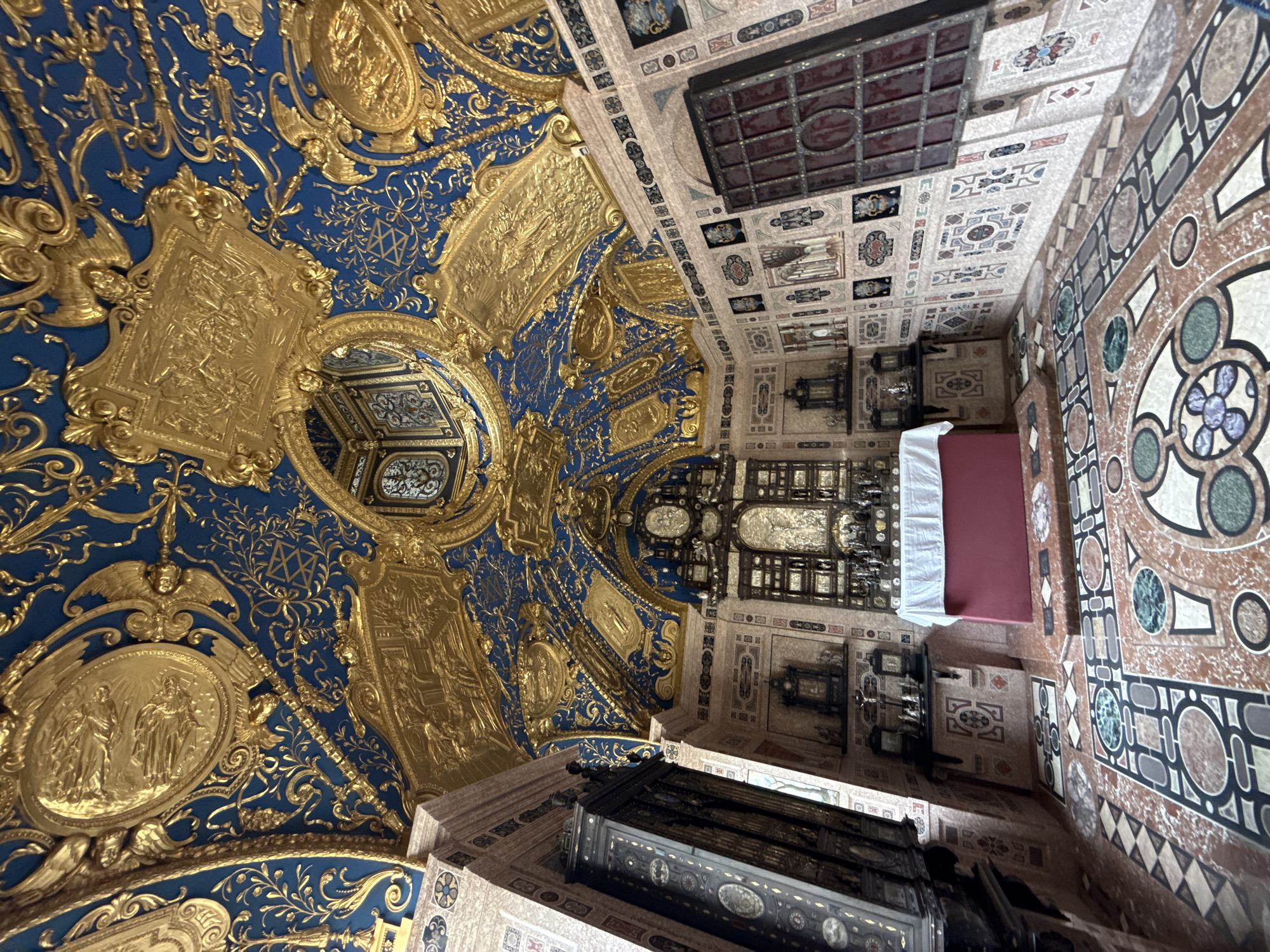 Tourist documents ornate interiors across historic Munich landmarks