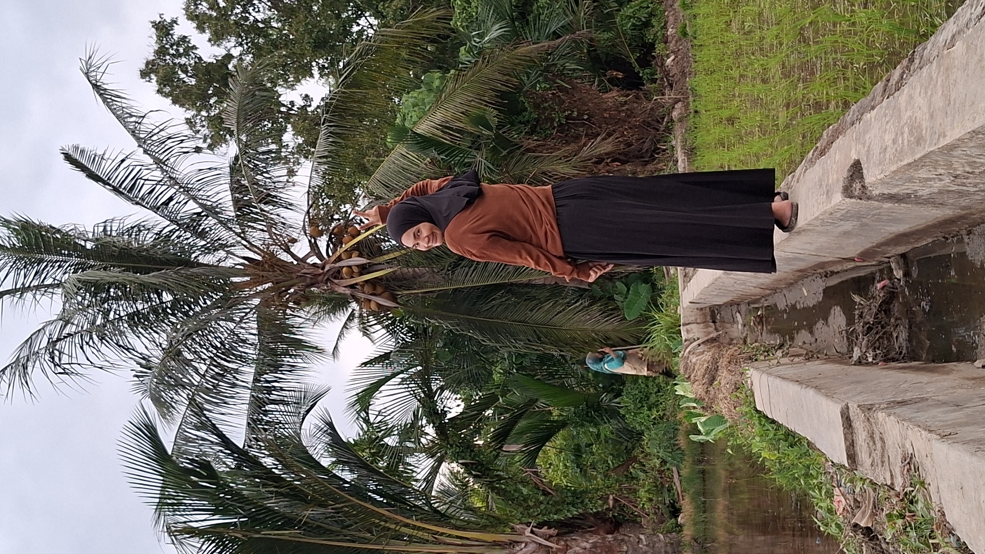 Exploring flooded rice paddies in rural Kutaglumpang, Indonesia