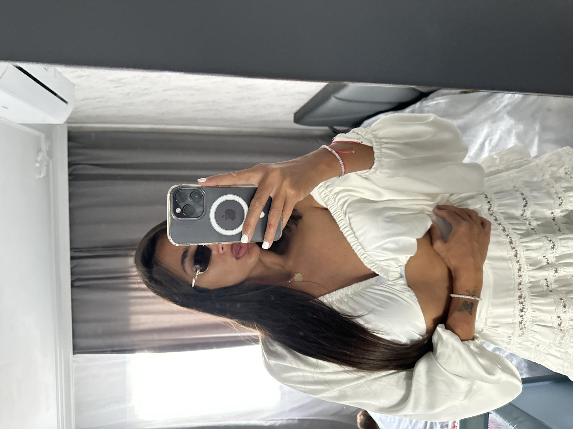 Woman conducts mirror selfie session in bedroom, Pernik Bulgaria
