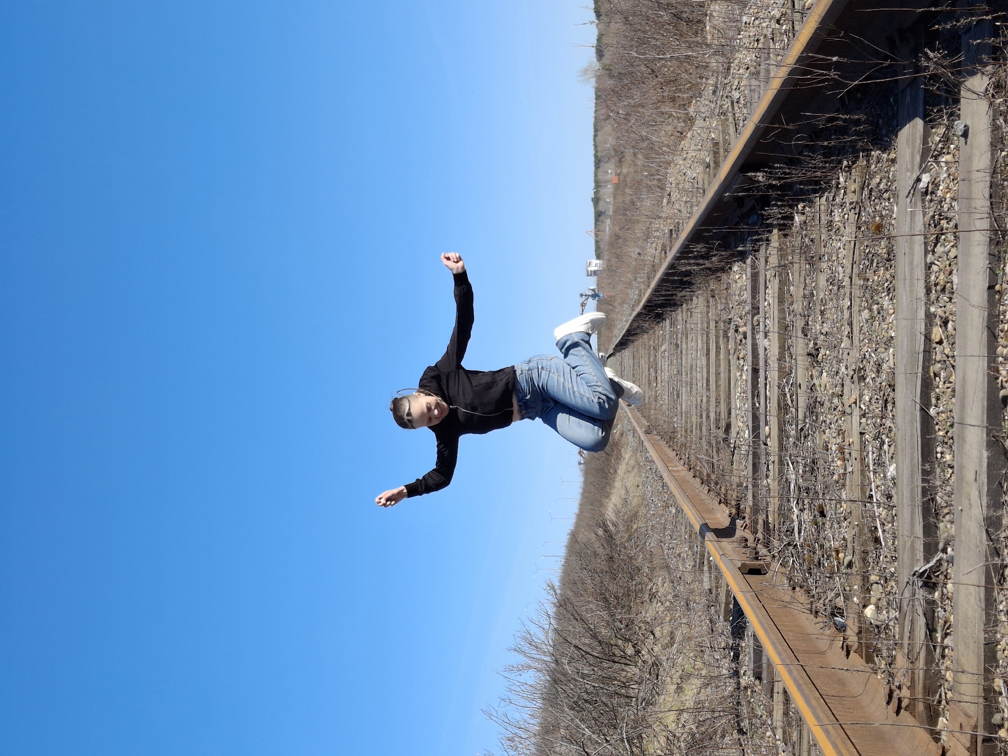 Young woman photographed around Chaikovsky, Russia under clear skies