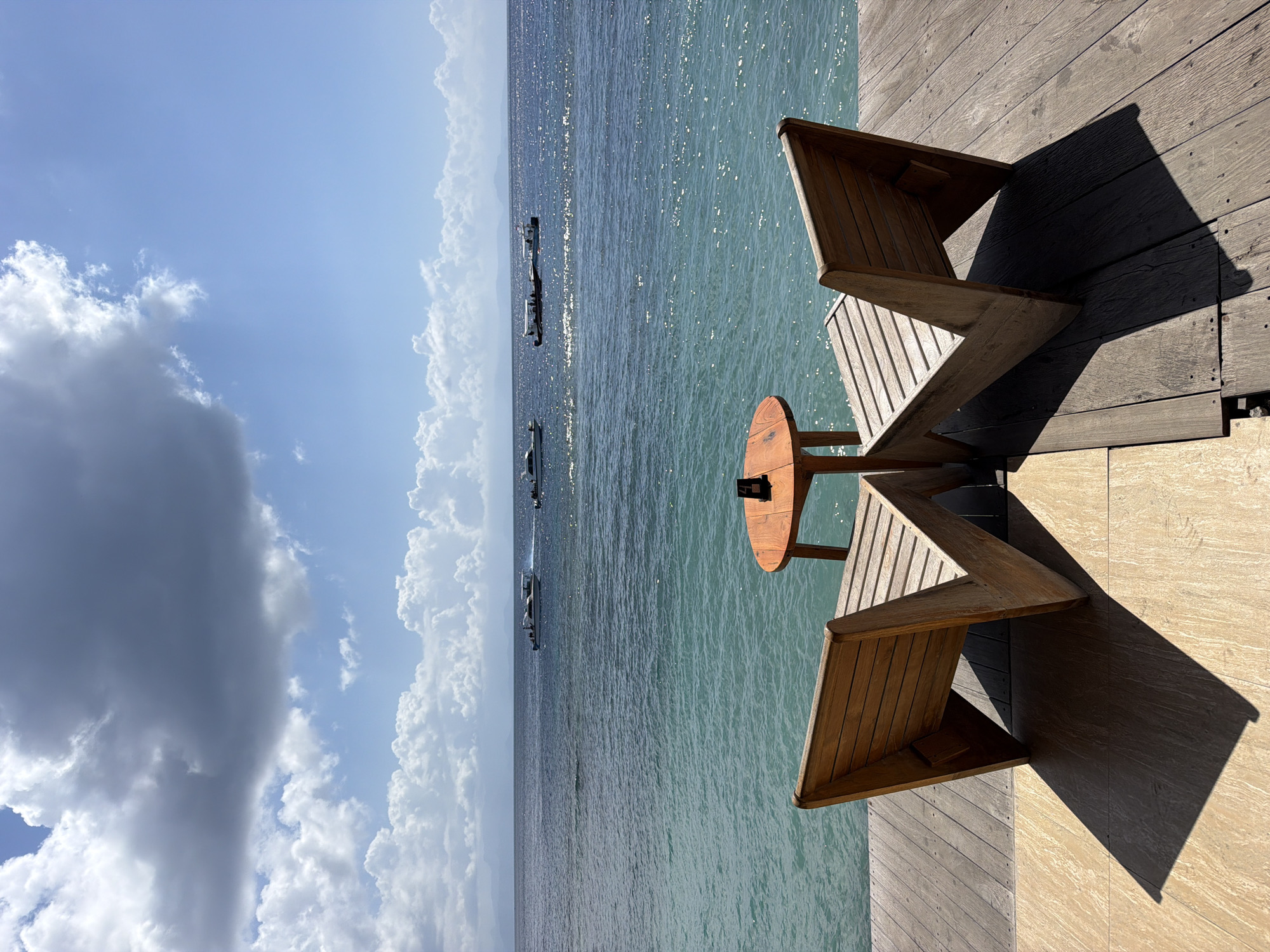 Oceanfront chairs and table set up in Nusa Penida