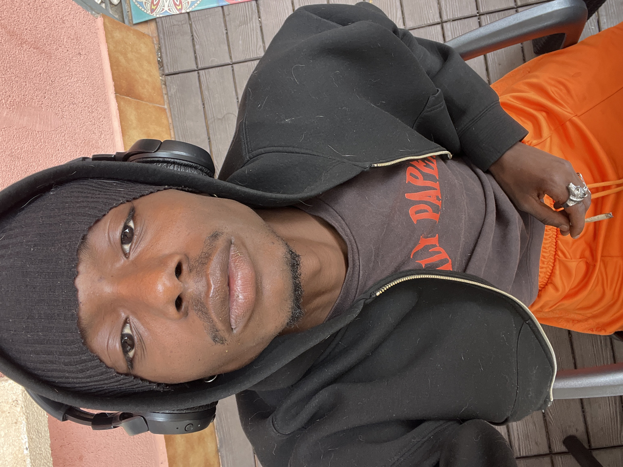 Young man photographed working outdoors with laptop in Barcelona