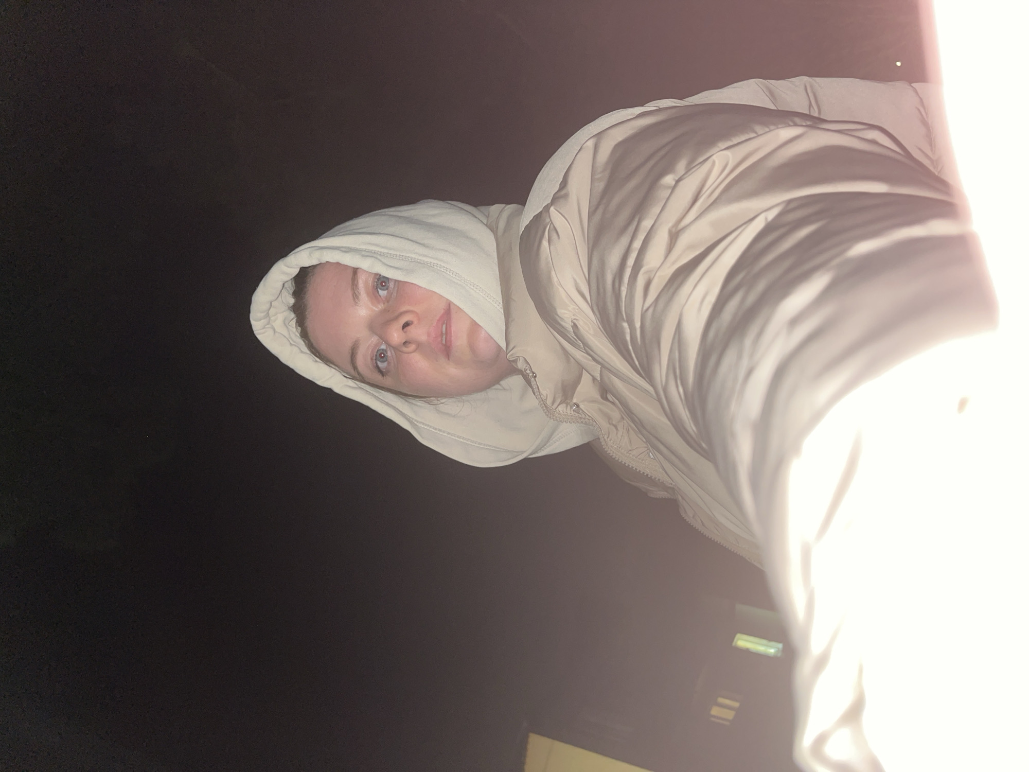 Person in hooded jacket photographed indoors in Раздолье