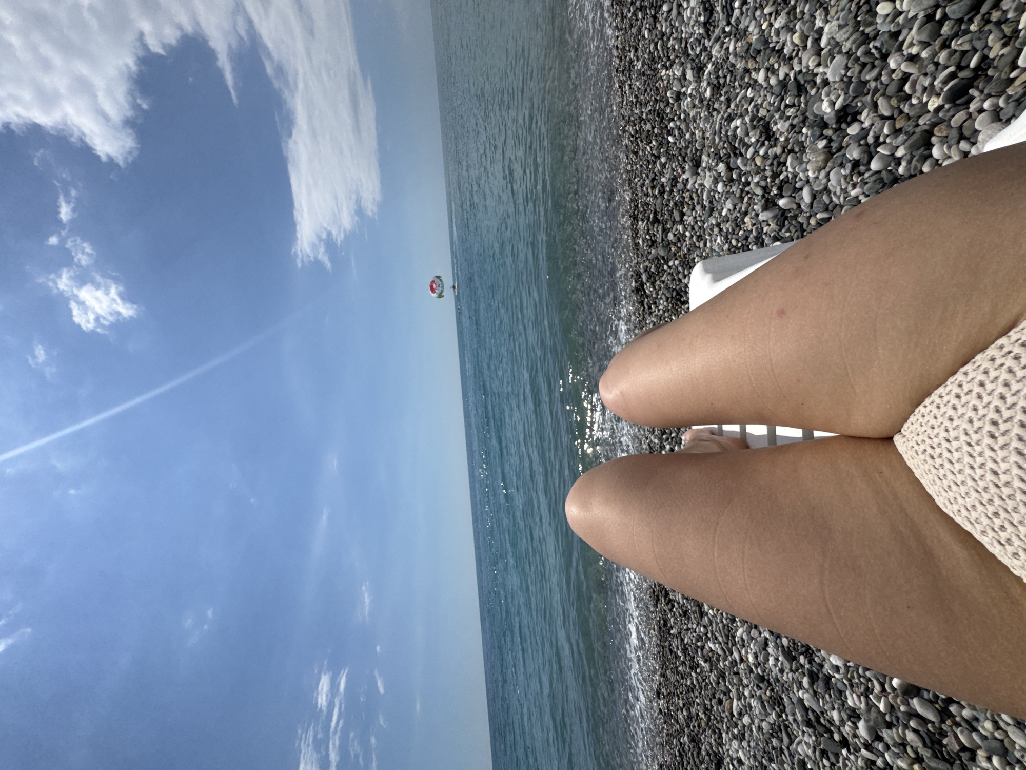 Lazy summer afternoon on Gagra's pebble beach, Black Sea