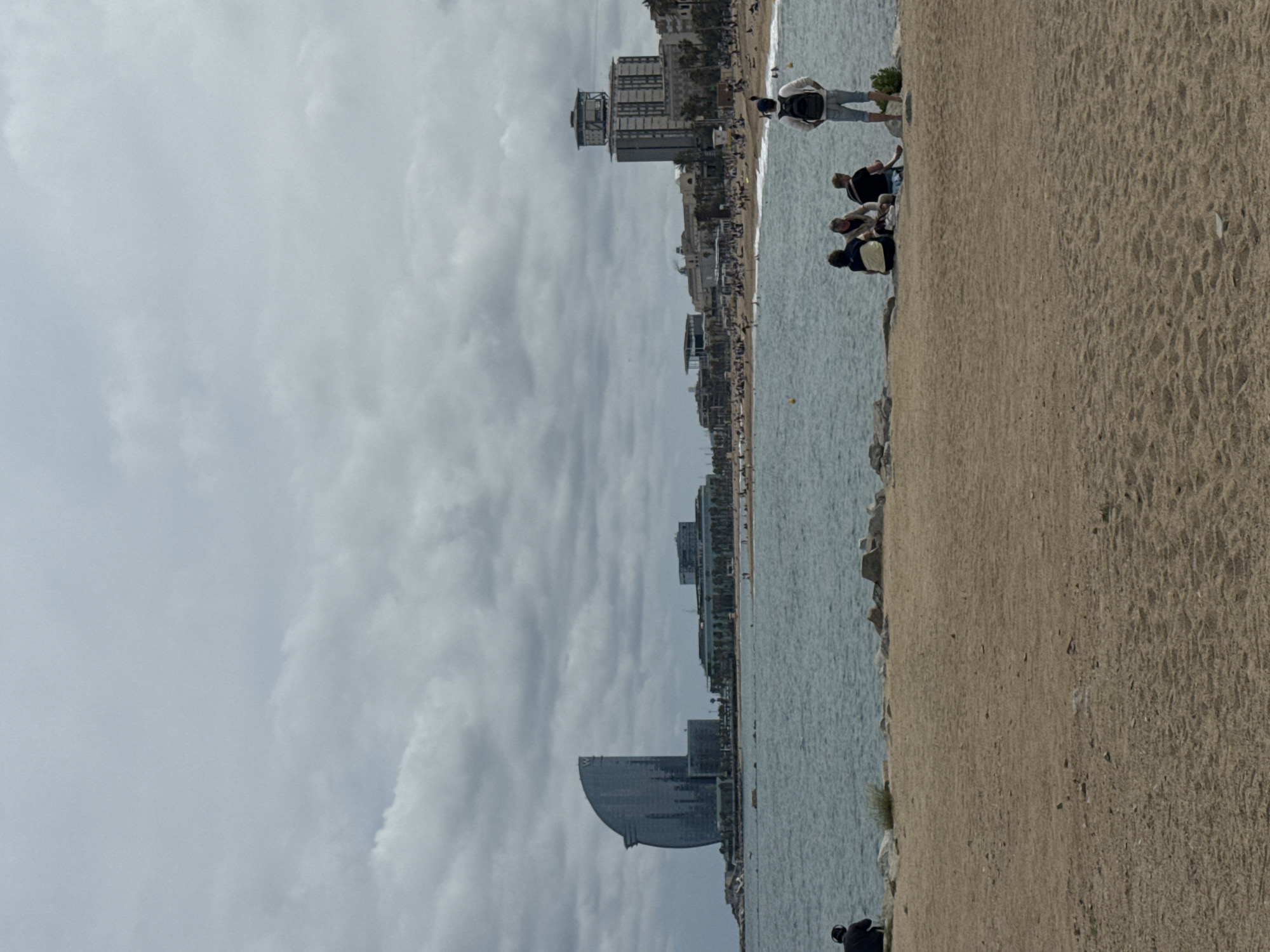 Barcelona beachfront activity captured during cloudy afternoon workout session