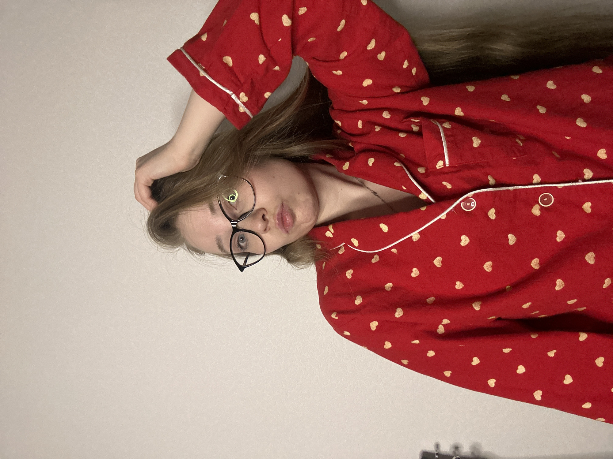 Woman in heart pajamas recorded during evening routine in Saint Petersburg