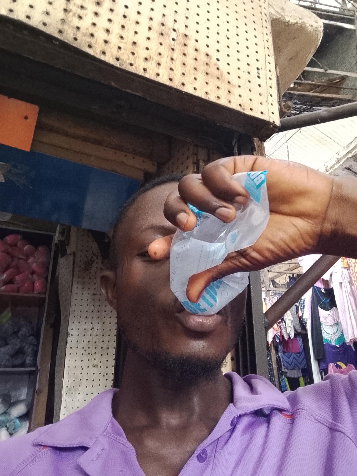 Man counts money at Nigerian market in Fegge