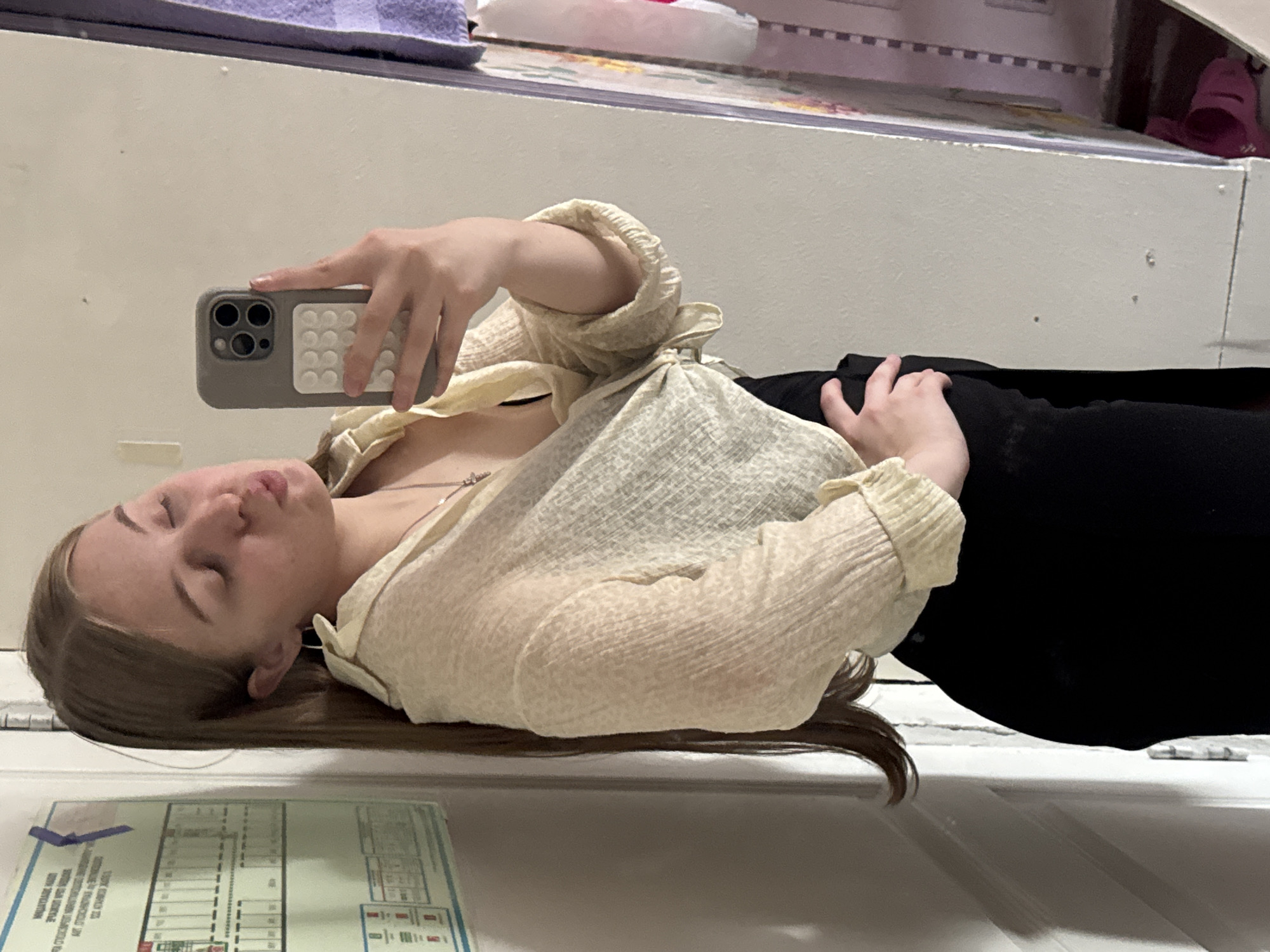 Woman takes mirror selfies in Perm apartment room