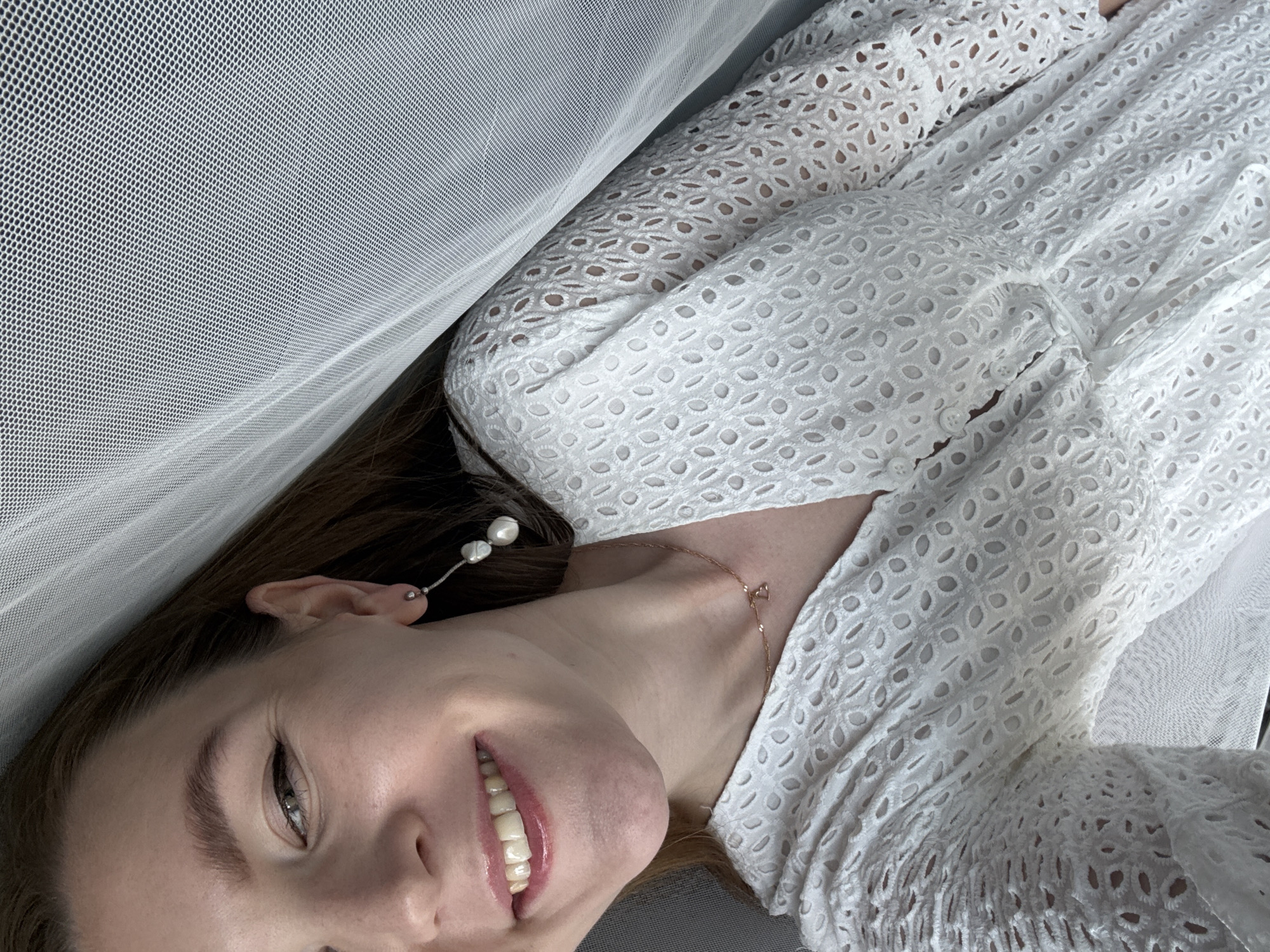 Smiling portrait in a white eyelet dress, Izhevsk