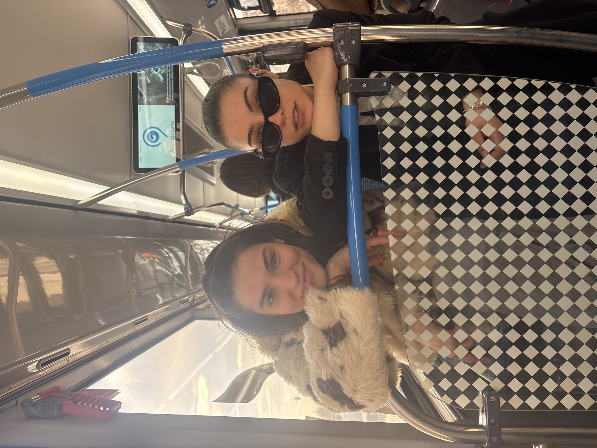Two women ride Moscow Metro train Friday afternoon