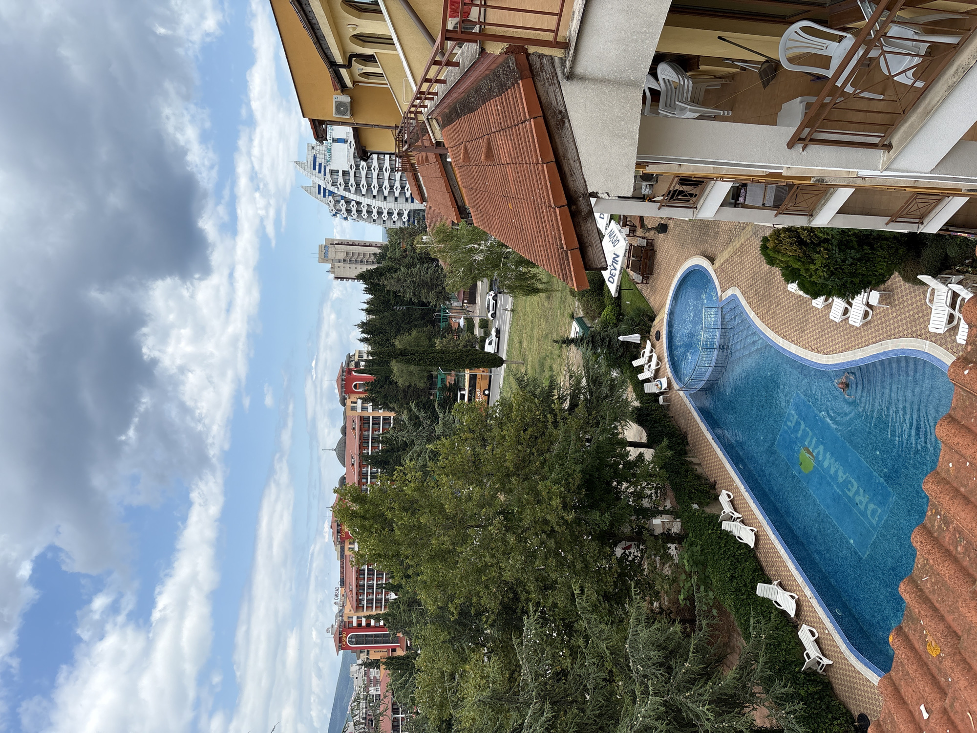 Hotel courtyard with red-tiled rooftops in coastal Nesebar