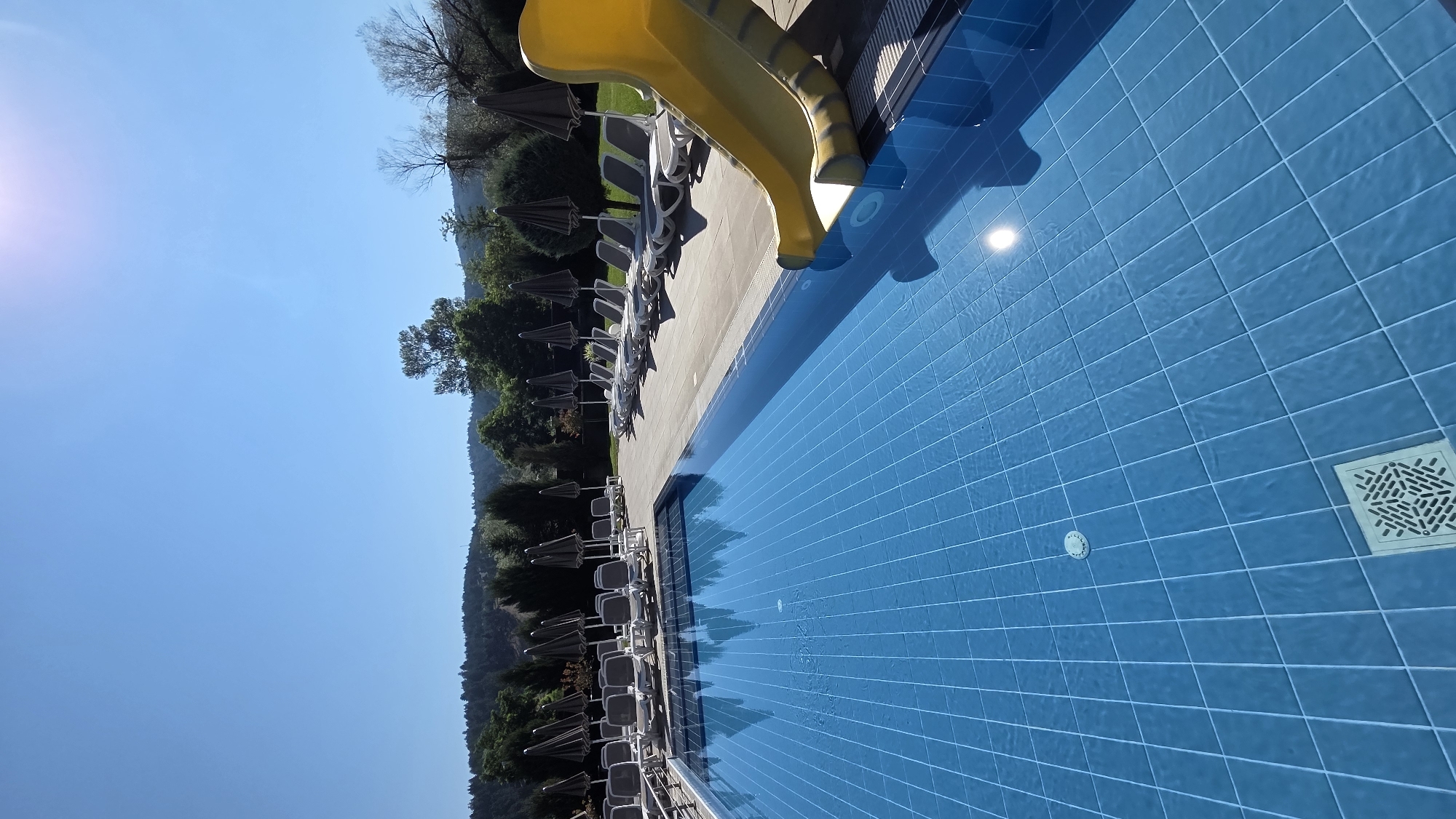 Sunny morning at a resort pool complex in Bania, Bulgaria