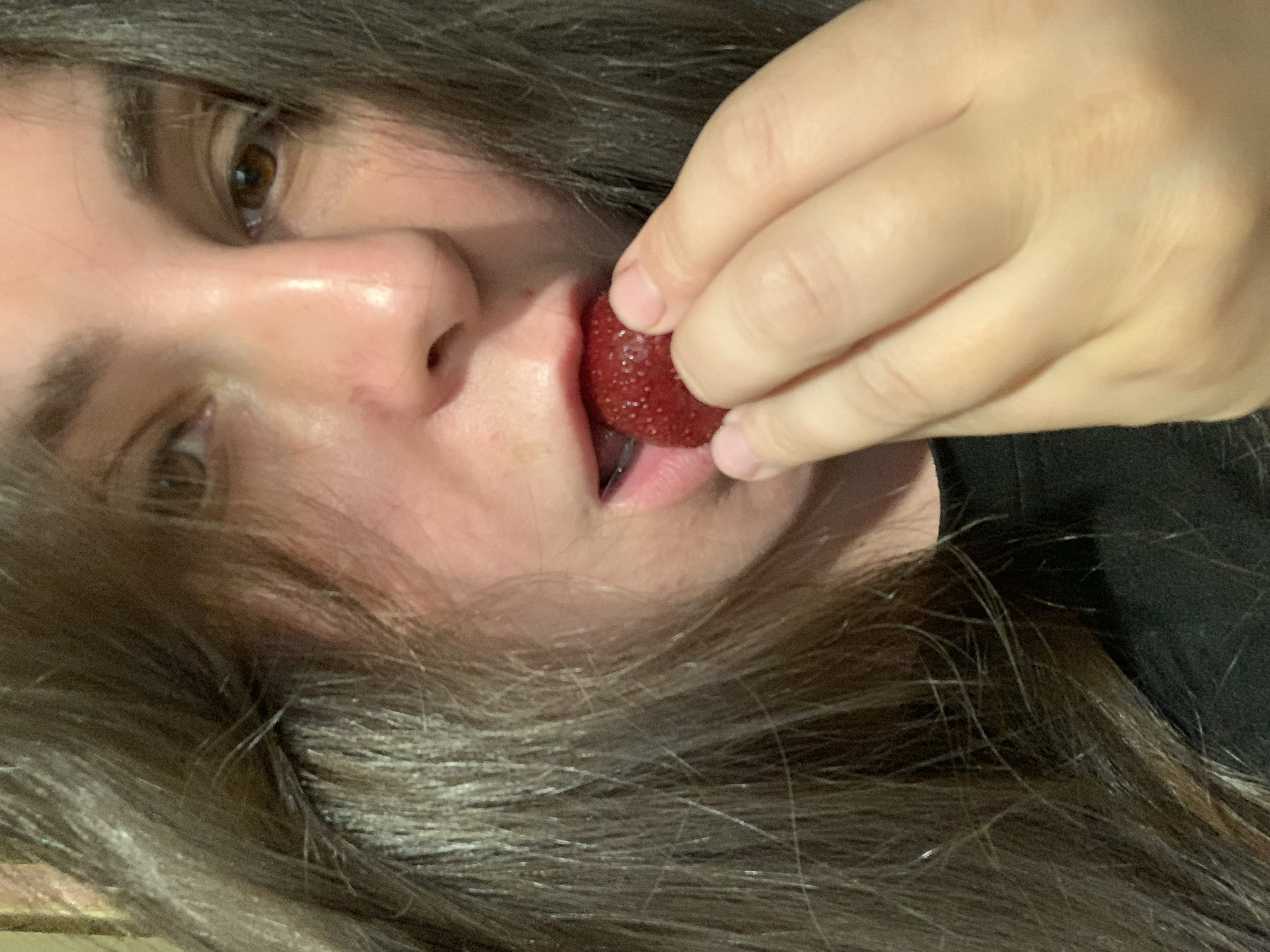 Close-up moments with fresh strawberries, eating and holding