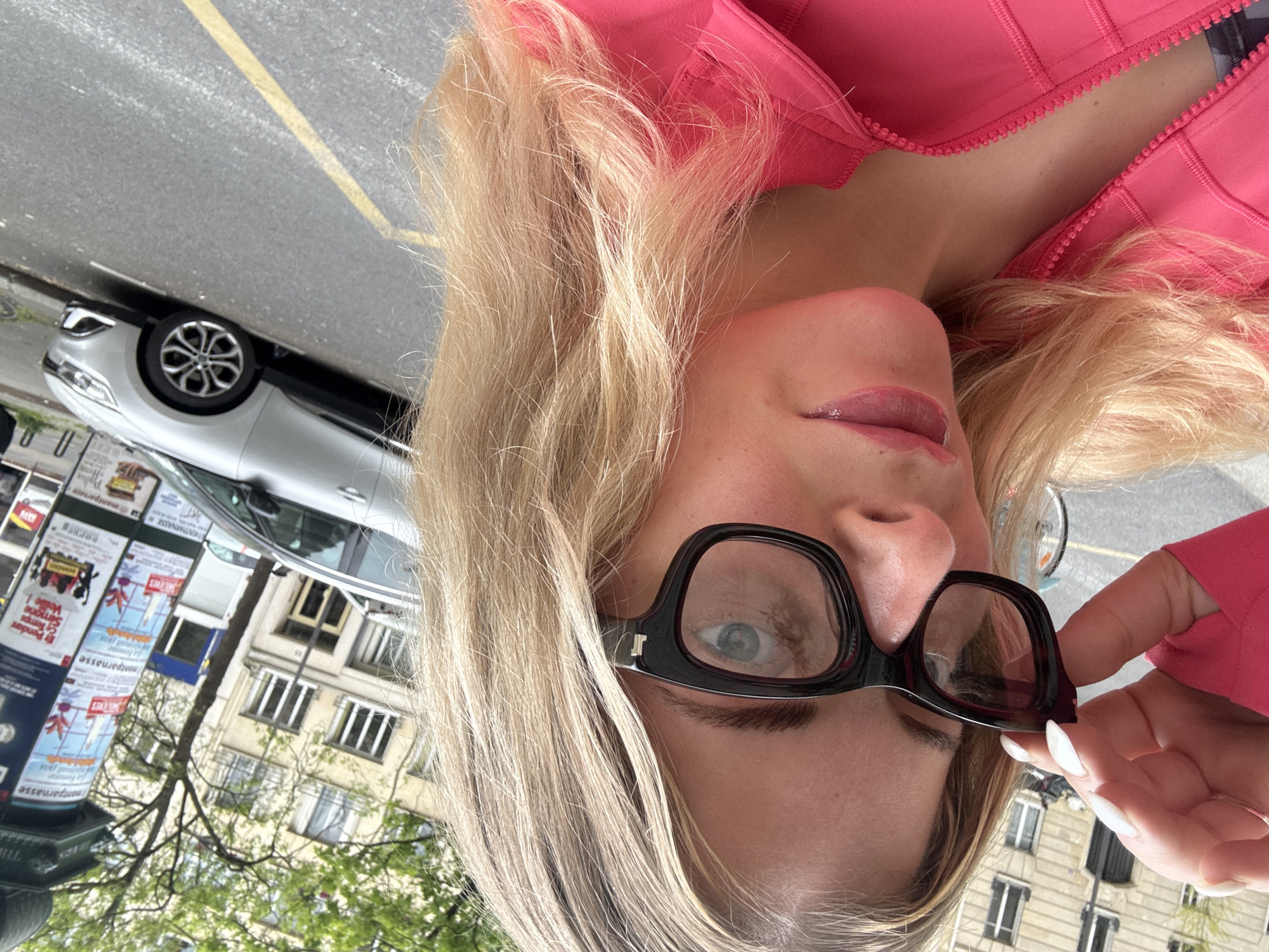 Woman Takes Selfie on Paris Street