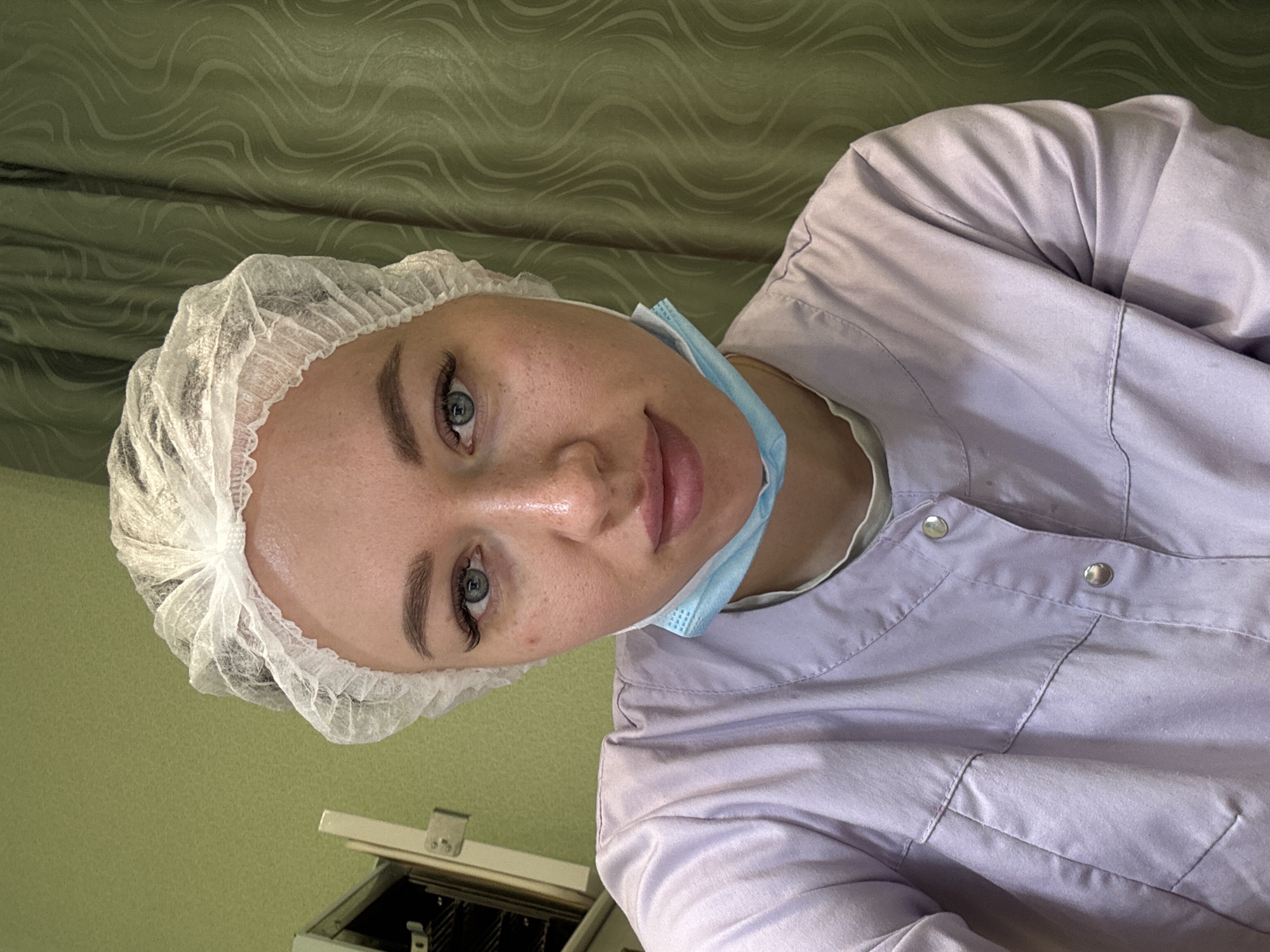 Medical worker in surgical attire observed during procedure in Russia