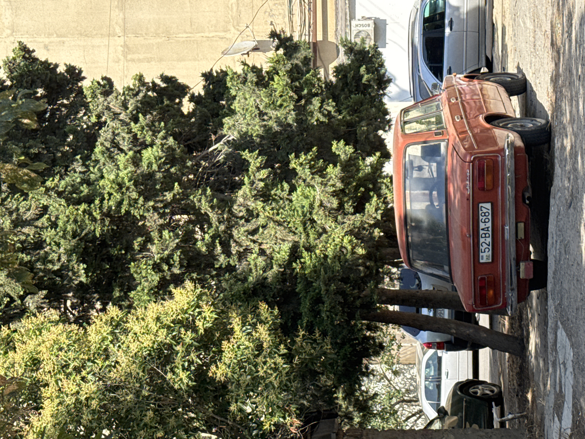 Everyday street parking and neighborhood scenes across Baku