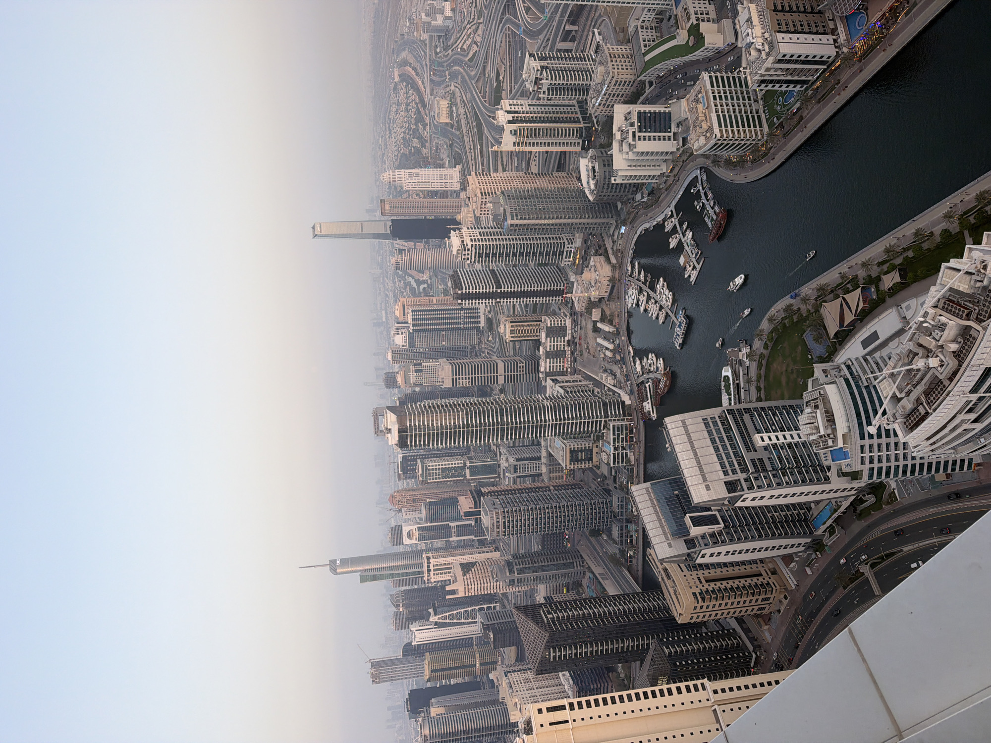 Tourist documents Dubai visit with selfies and aerial cityscape photography