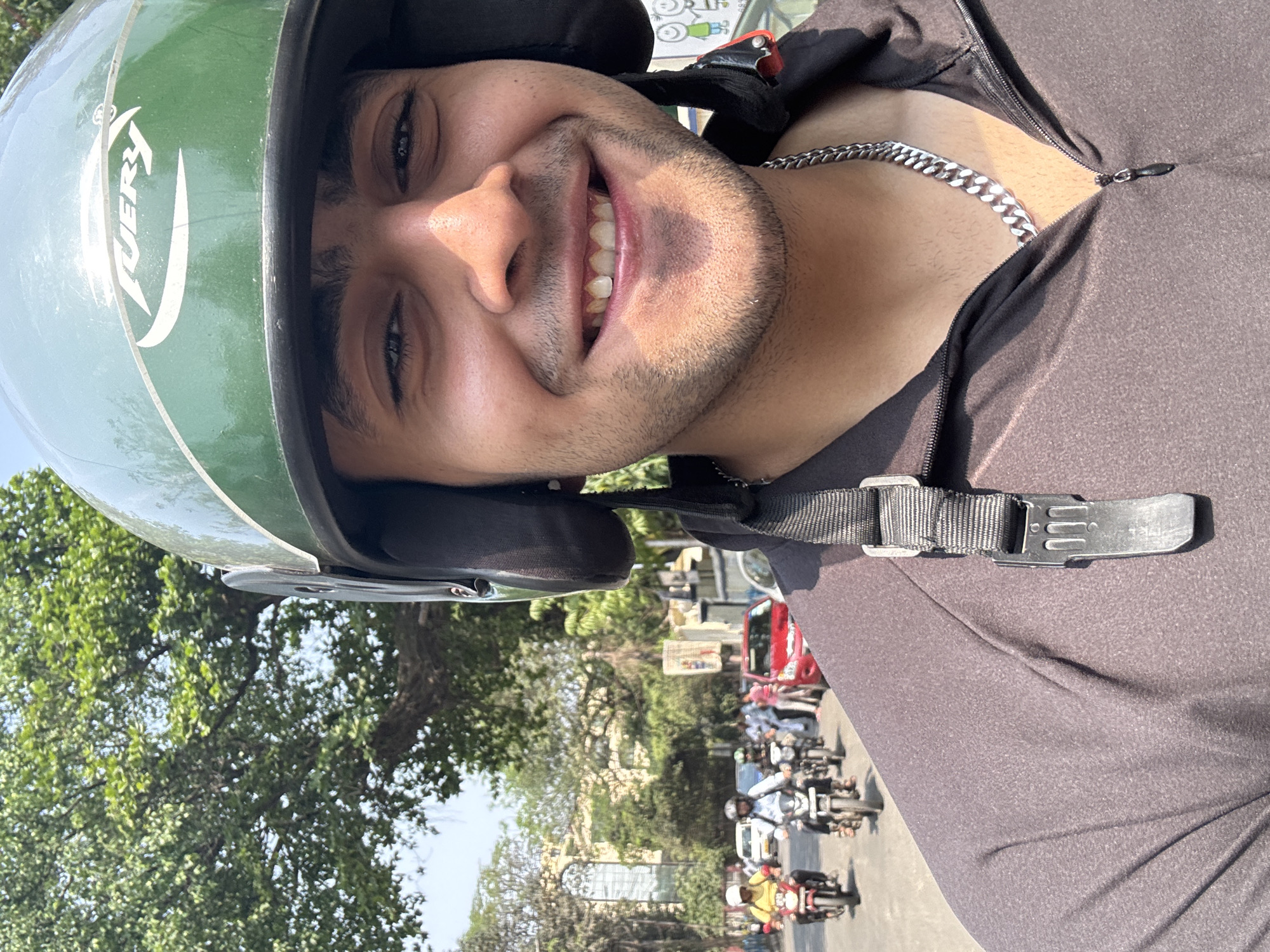 Motorcyclist takes selfies while riding through Kolkata streets