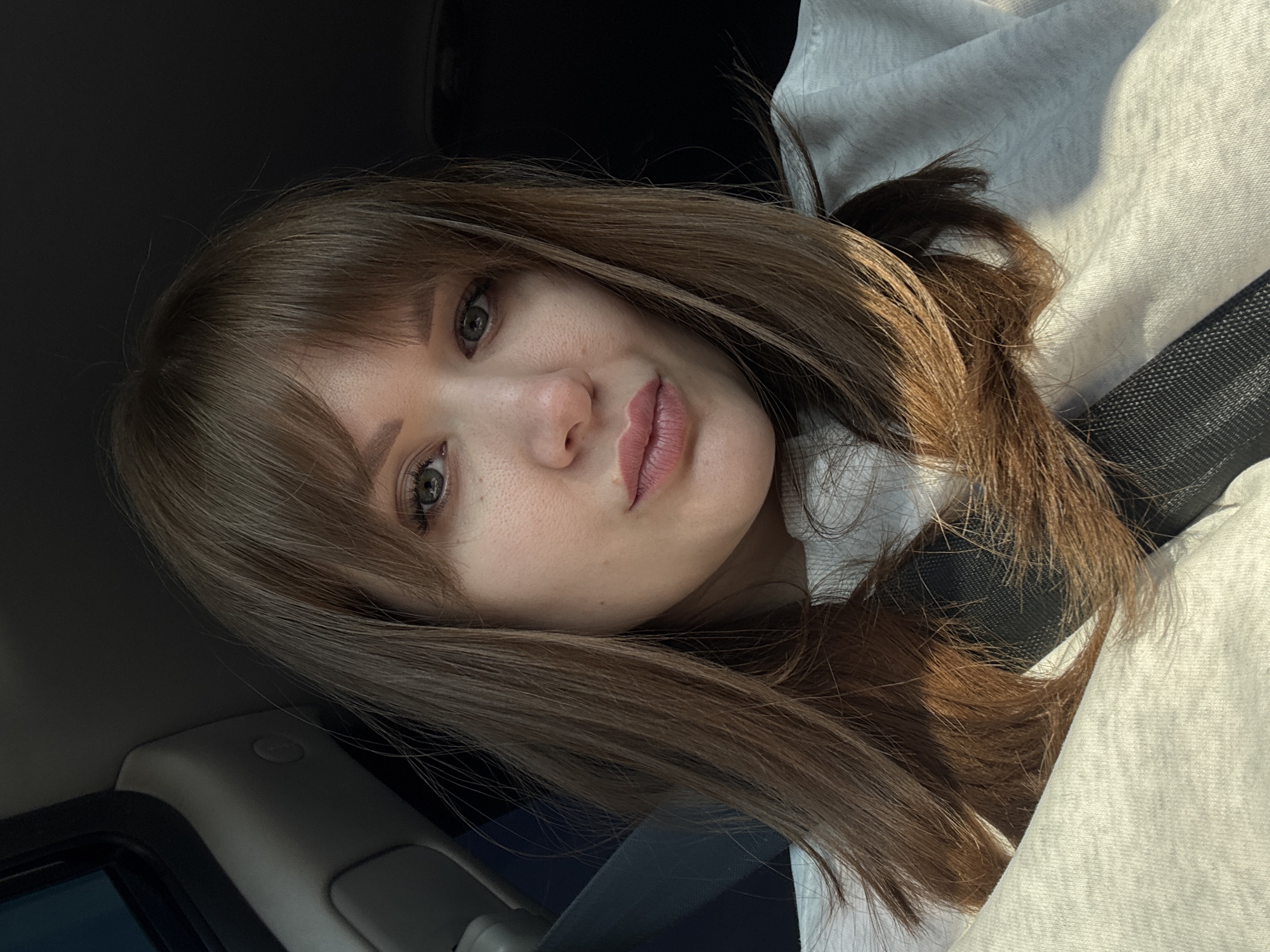 Woman takes selfie in vehicle in Alnashi, Russia