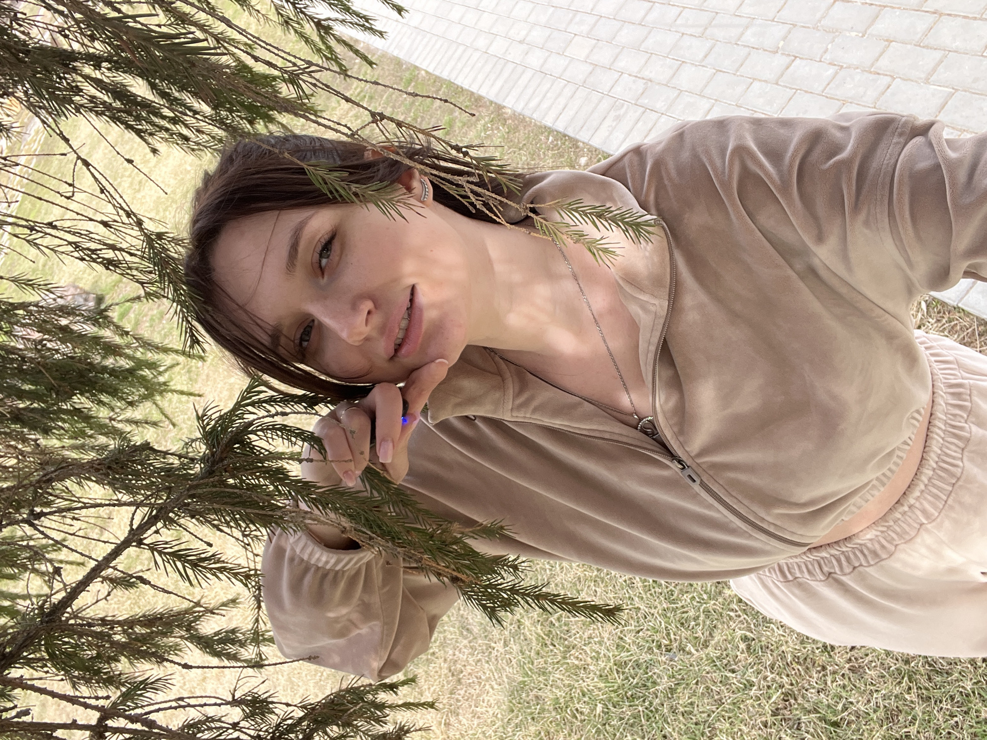 Woman visits park in Kargapolye, Russia on spring morning