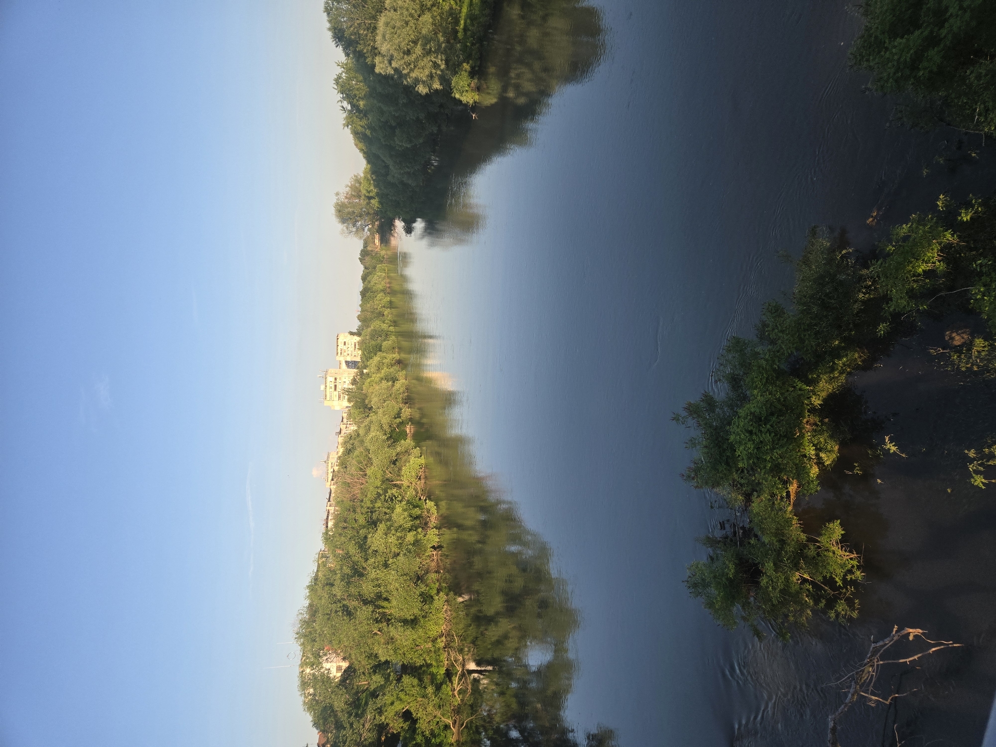 Dawn documentation captures waterway, residential area, parked vehicles