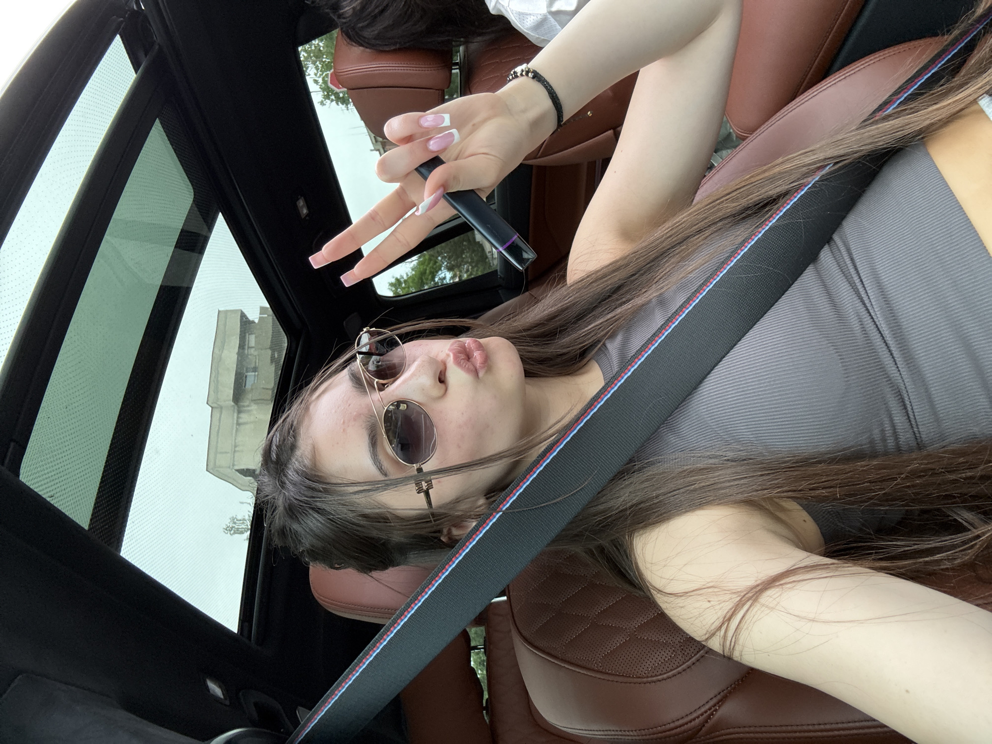 Woman in sunglasses observed in car in Plovdiv