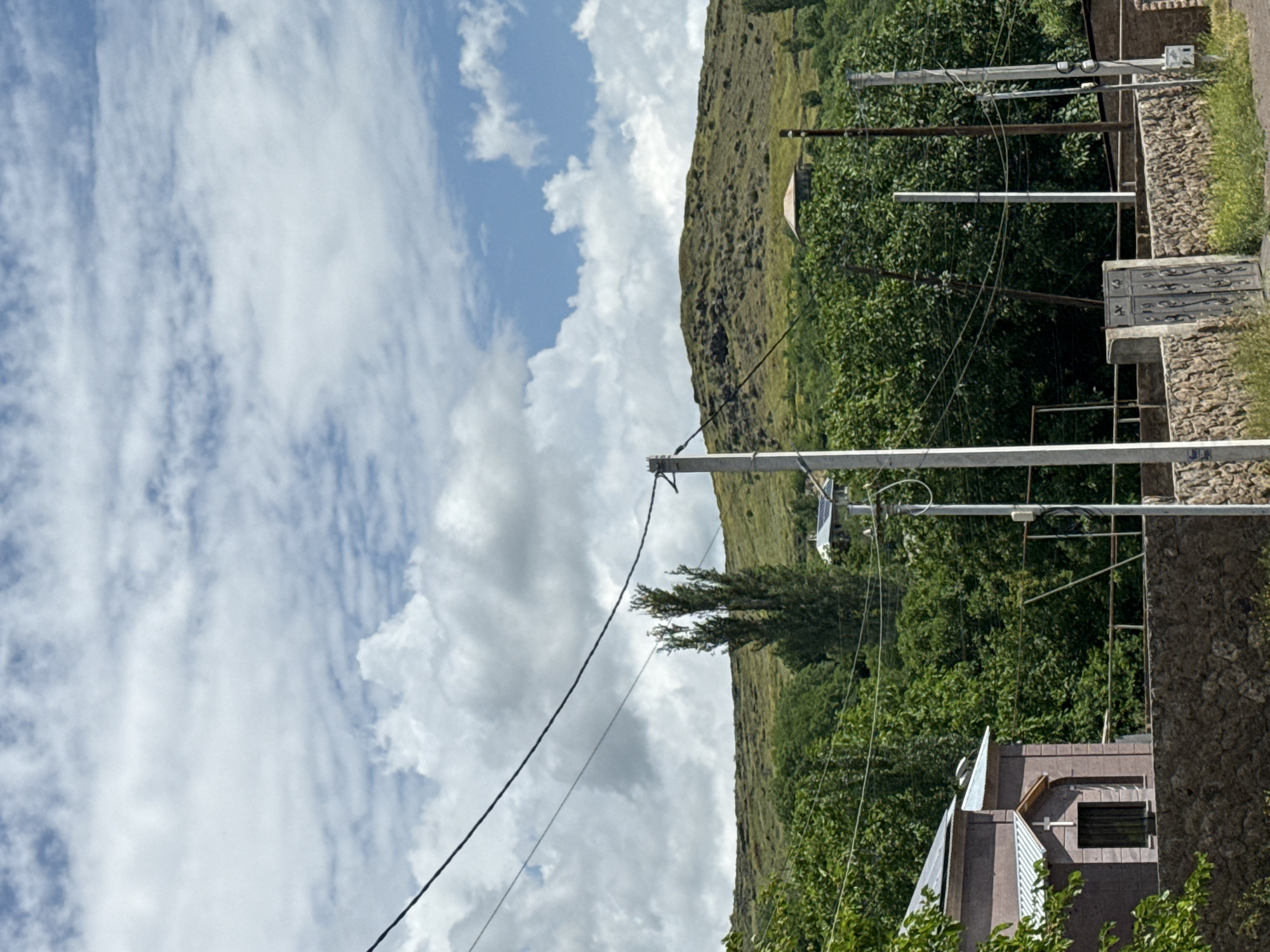Rural landscape with stone wall and gate documented