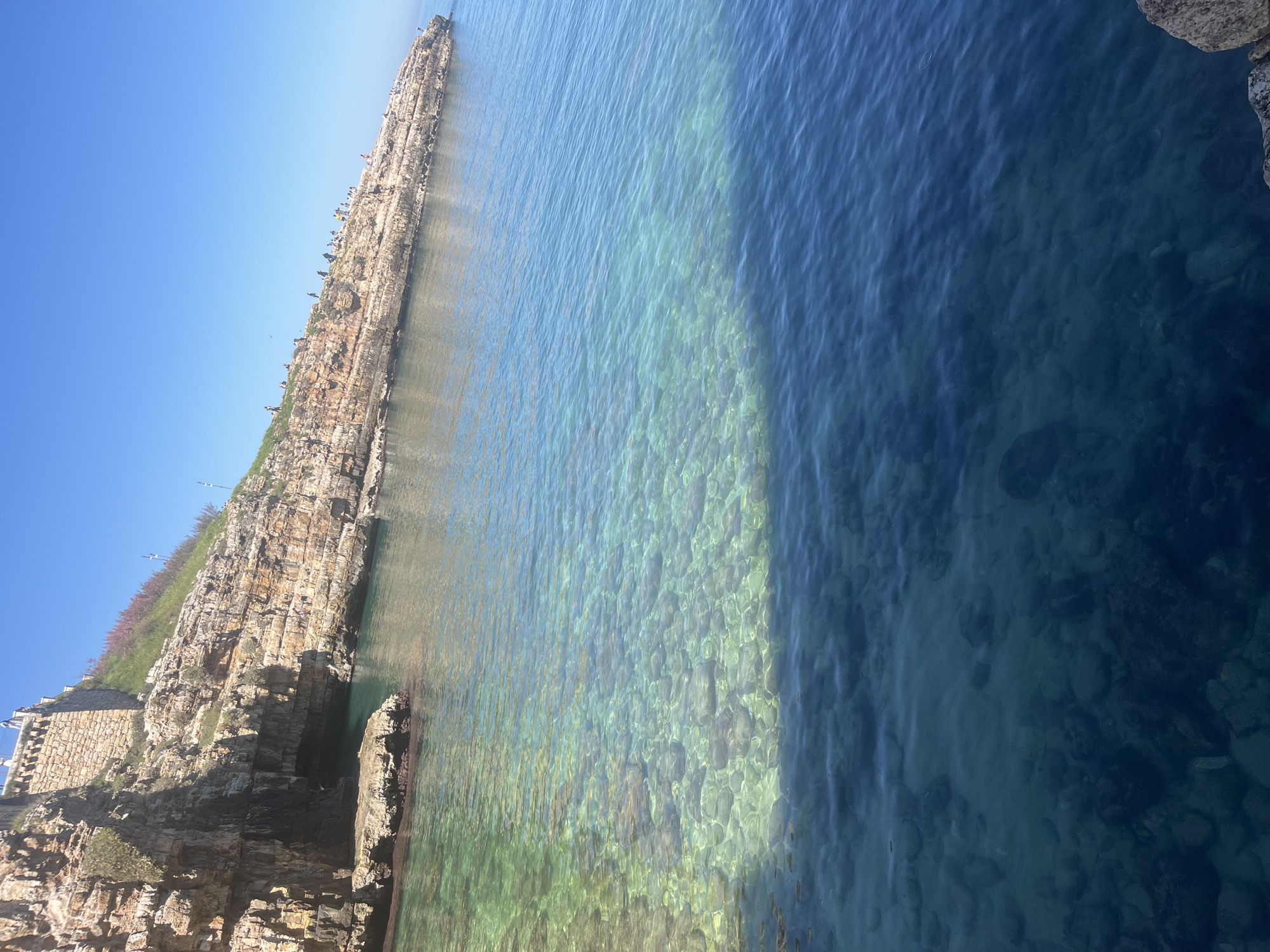Visitor documents sunny morning scenes in Polignano a Mare
