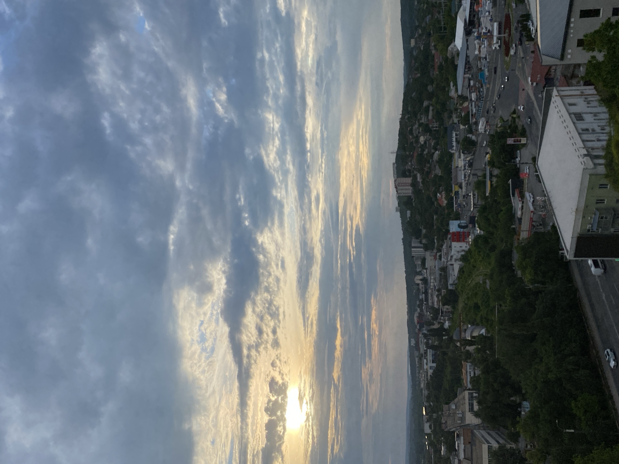 Chișinău from above, dramatic skies and green city canopy