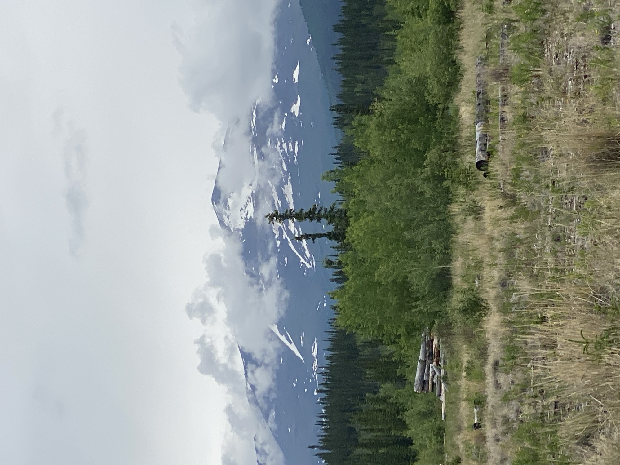 Snow-capped peaks and cloud cover in the Yukon wilderness