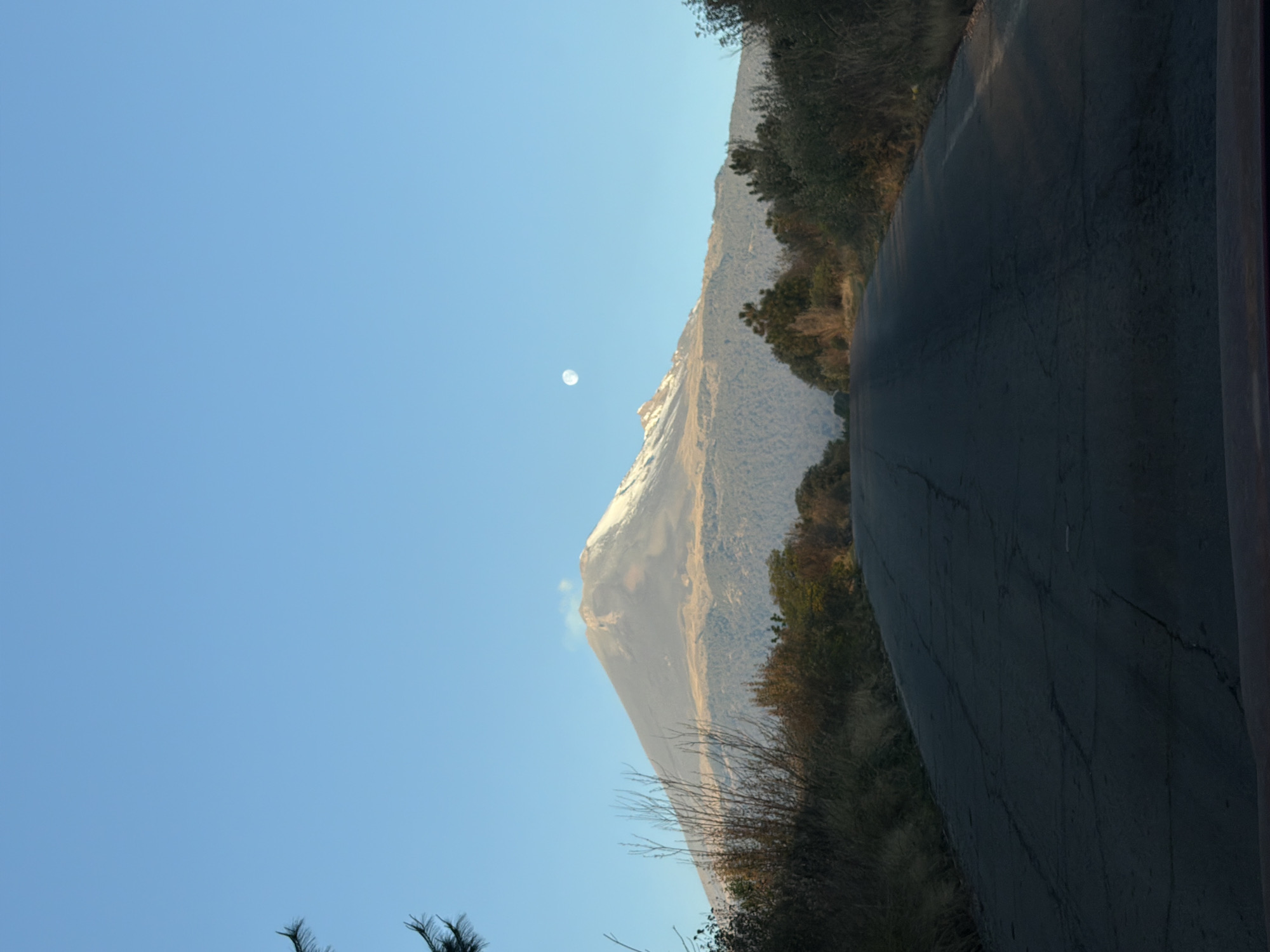 Clear skies reveal Popocatépetl volcano from Santiago Xalitzintla road