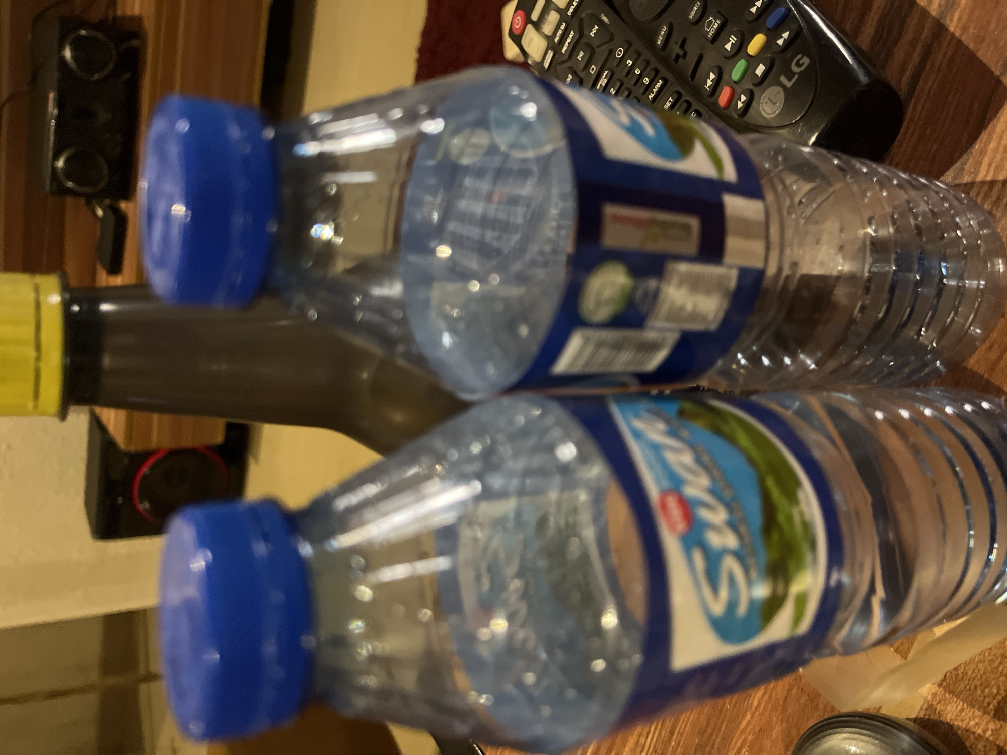 Router, Wi-Fi extender, and water bottles in a Jos interior