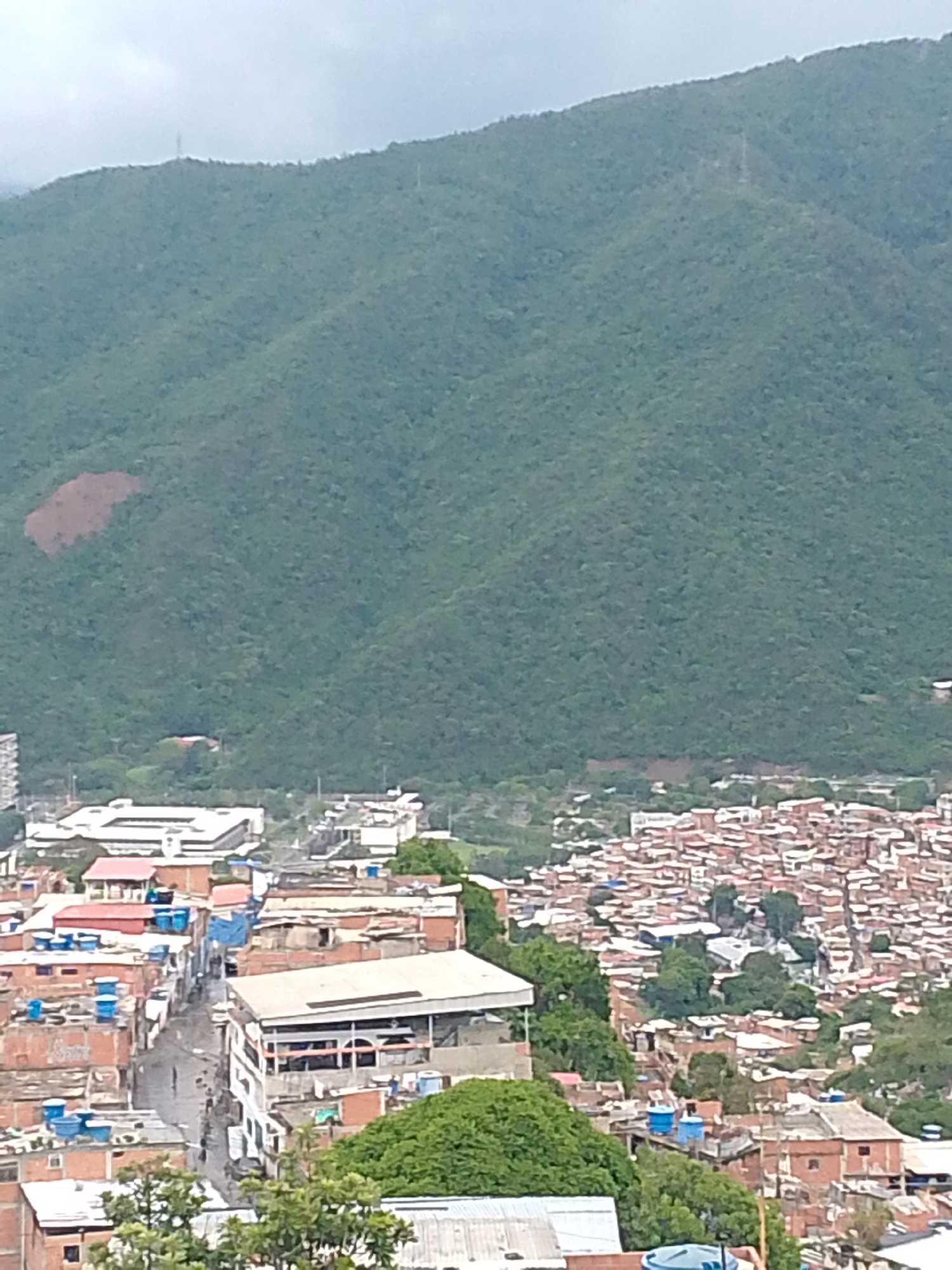 Rainy evening over Caracas barrios, with a few indoor oddities