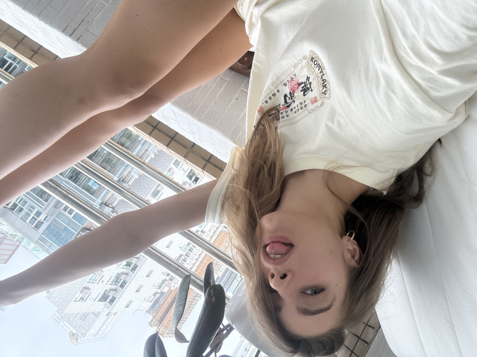 Woman observed resting on white surface in Hong Kong