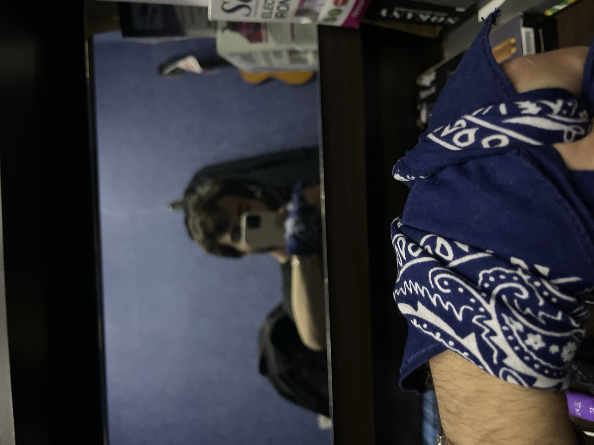 Man takes multiple mirror selfies in Tbilisi room