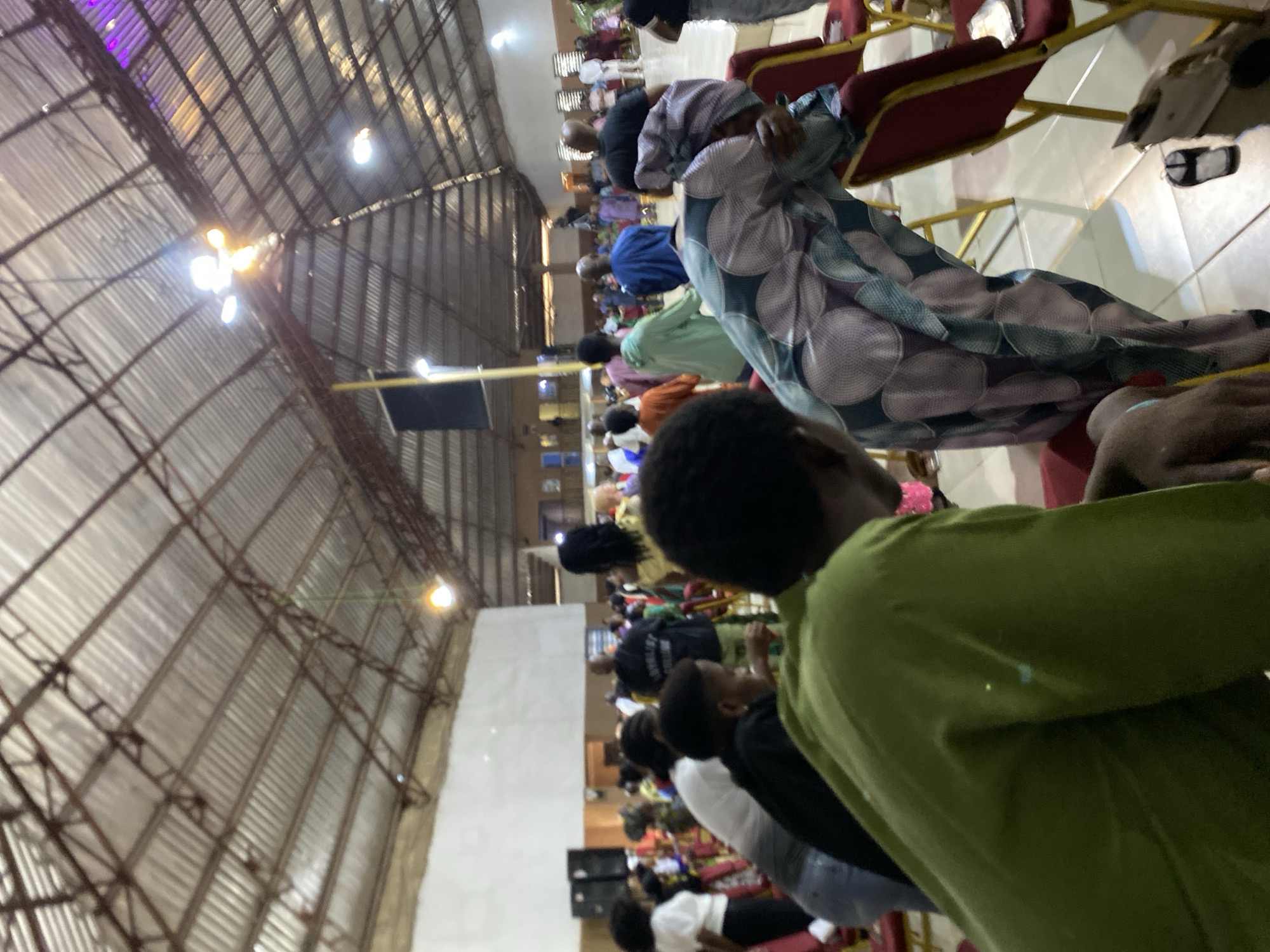 Speaker addresses morning gathering in large indoor venue