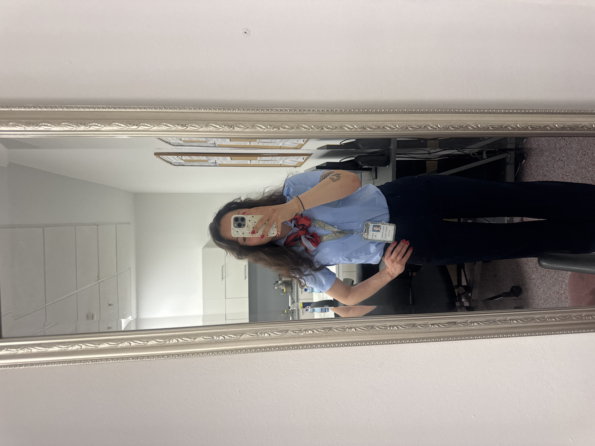 Woman takes mirror selfie in uniform in Burgas