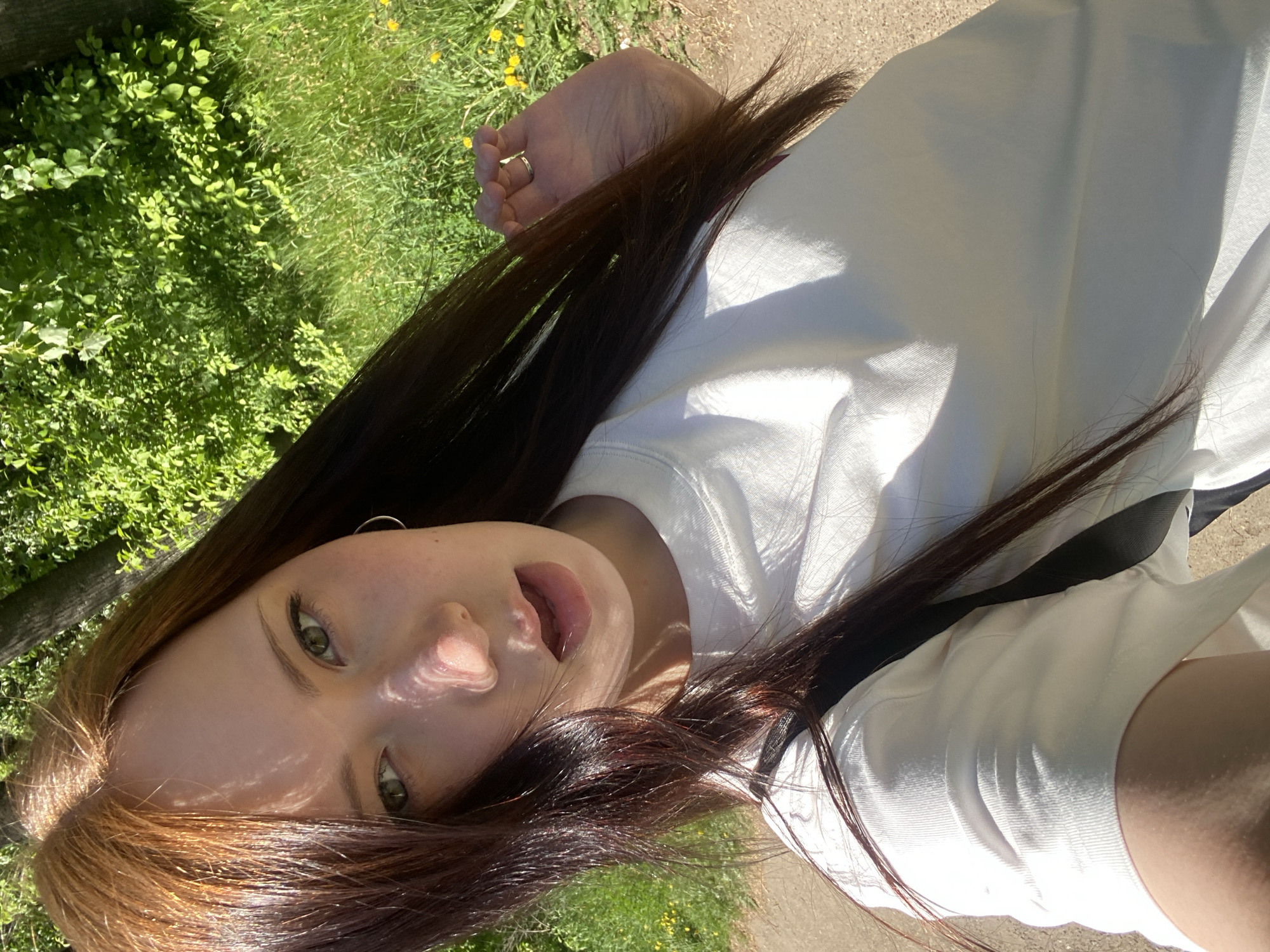 Woman photographed during outdoor photo session in park setting