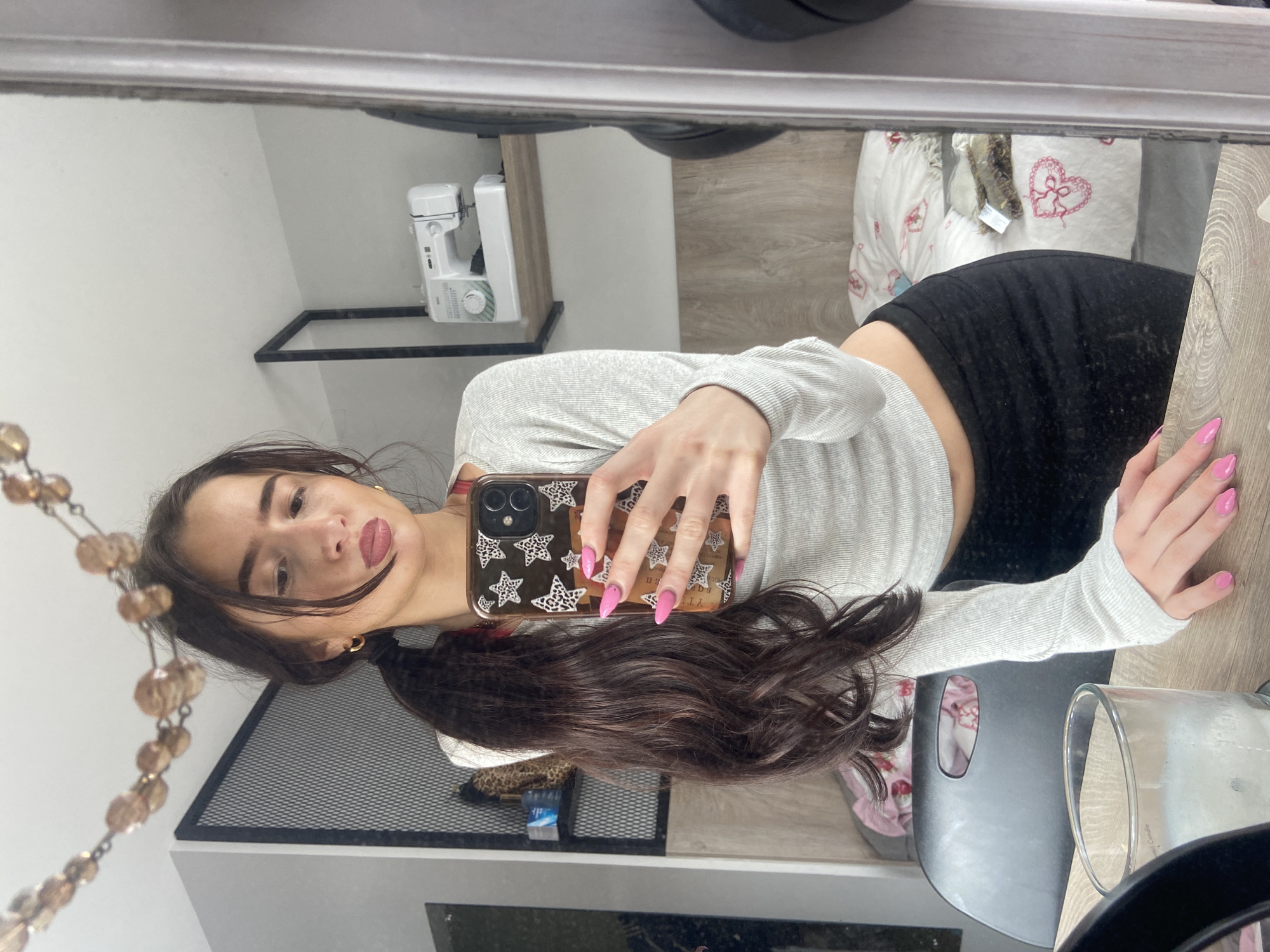 Woman takes multiple mirror selfies in London bedroom