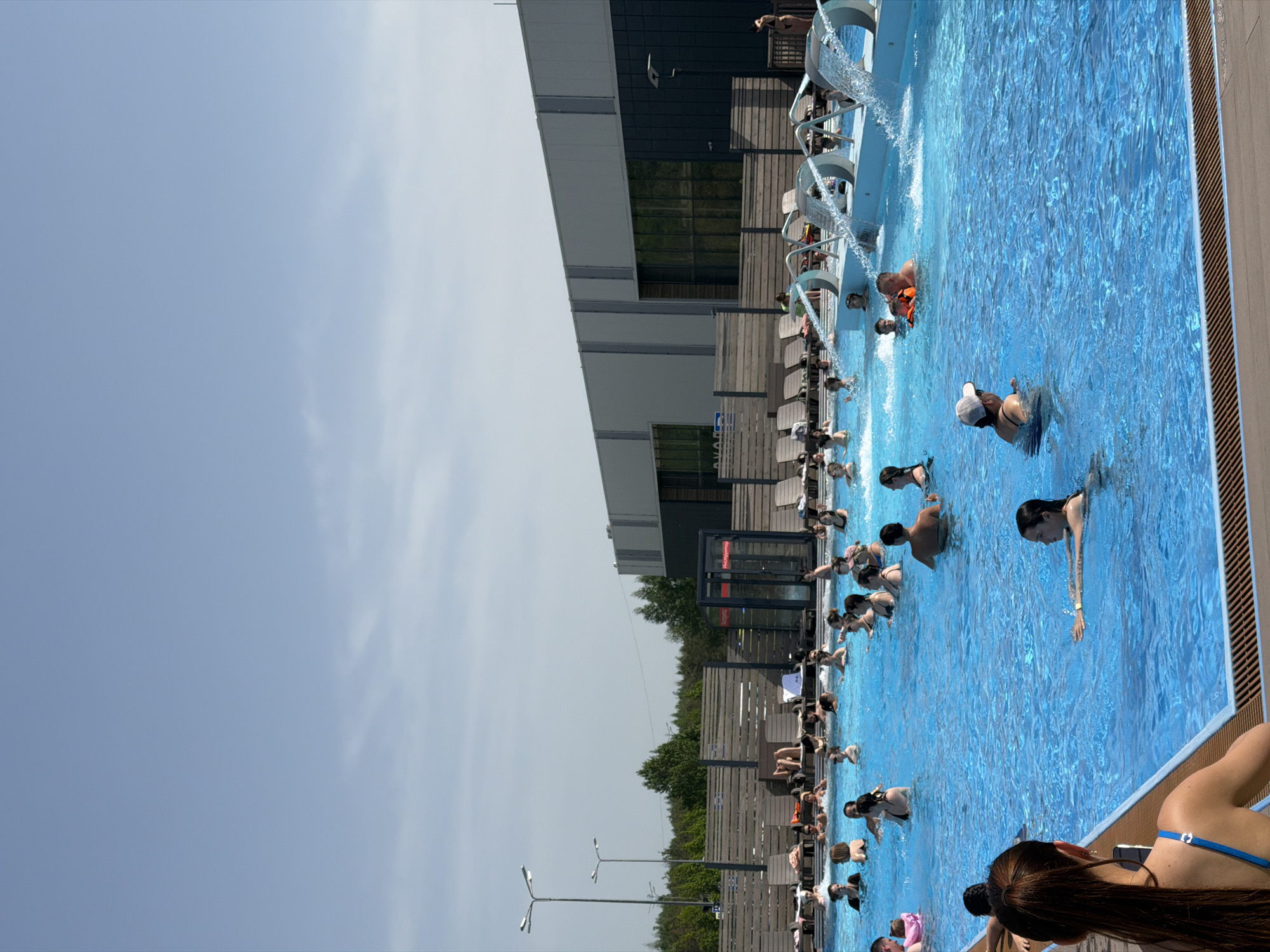 Busy swimming pool draws crowds in Kazan on sunny day