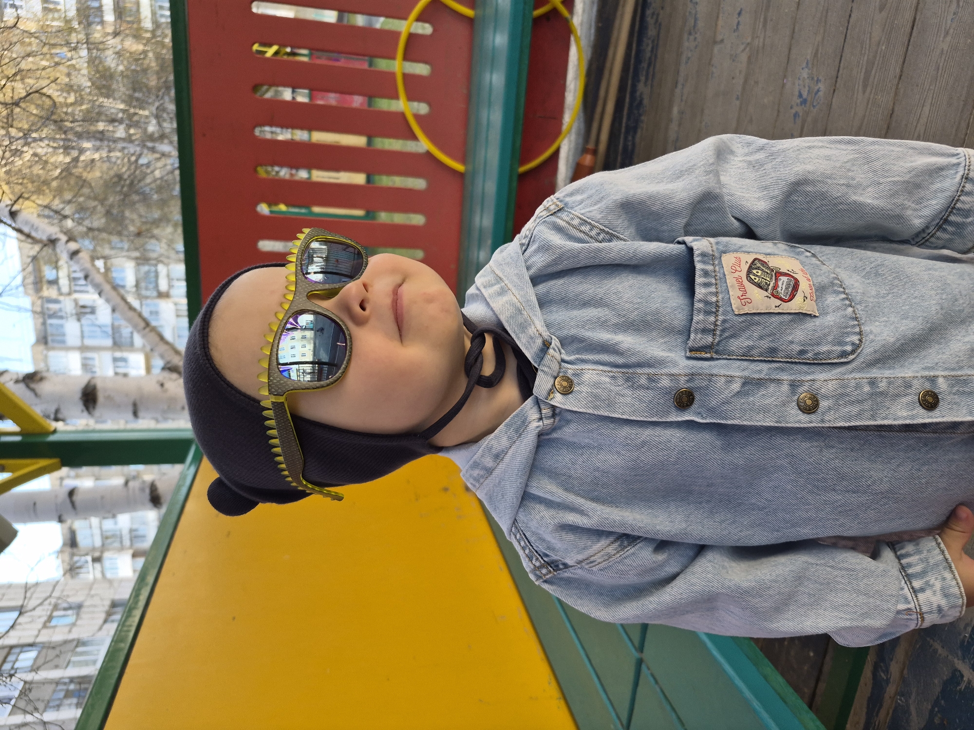 Children play with toy vehicles in Tobolsk playground
