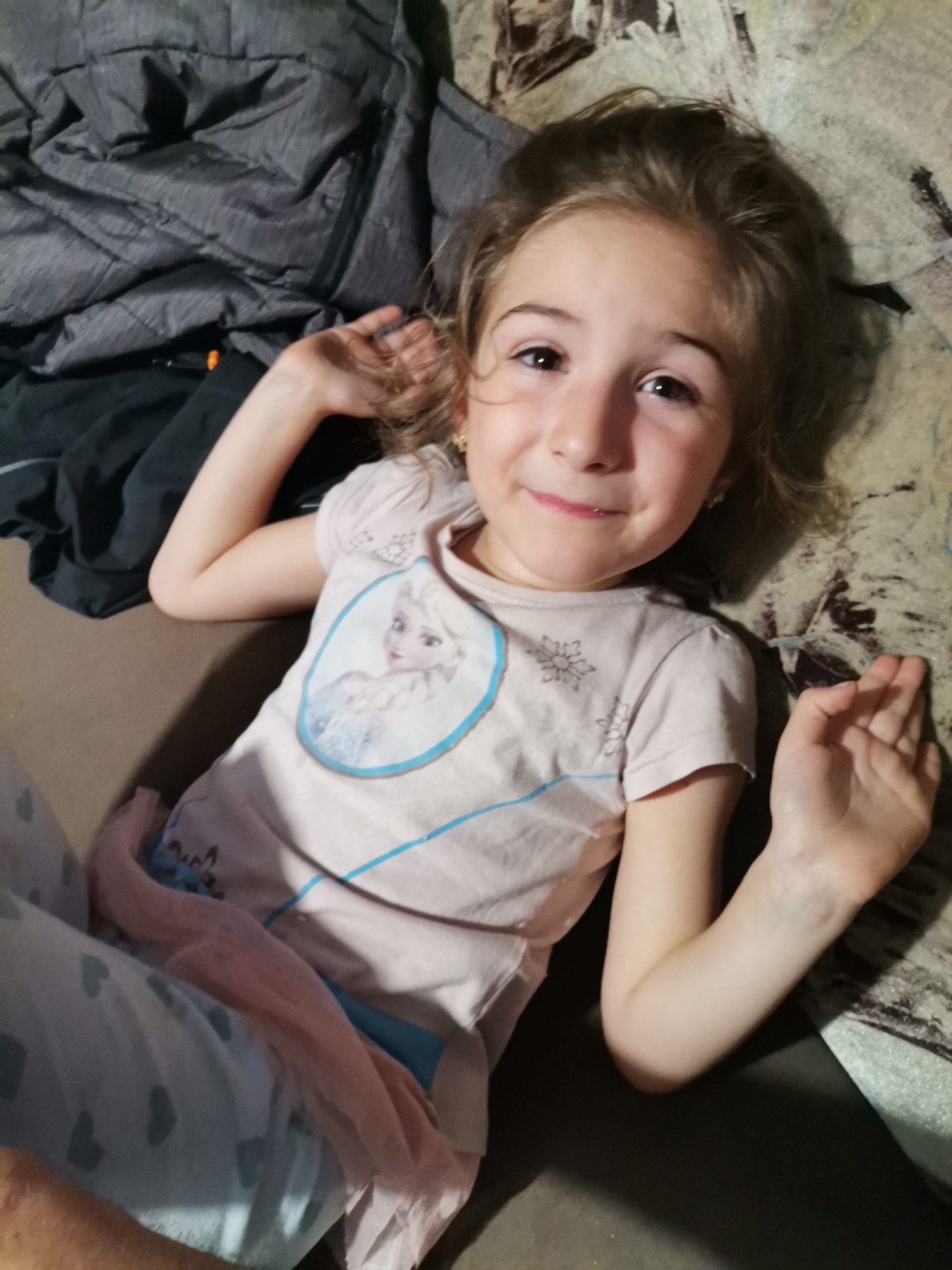 Children photographed in casual indoor moments in Obrochishte