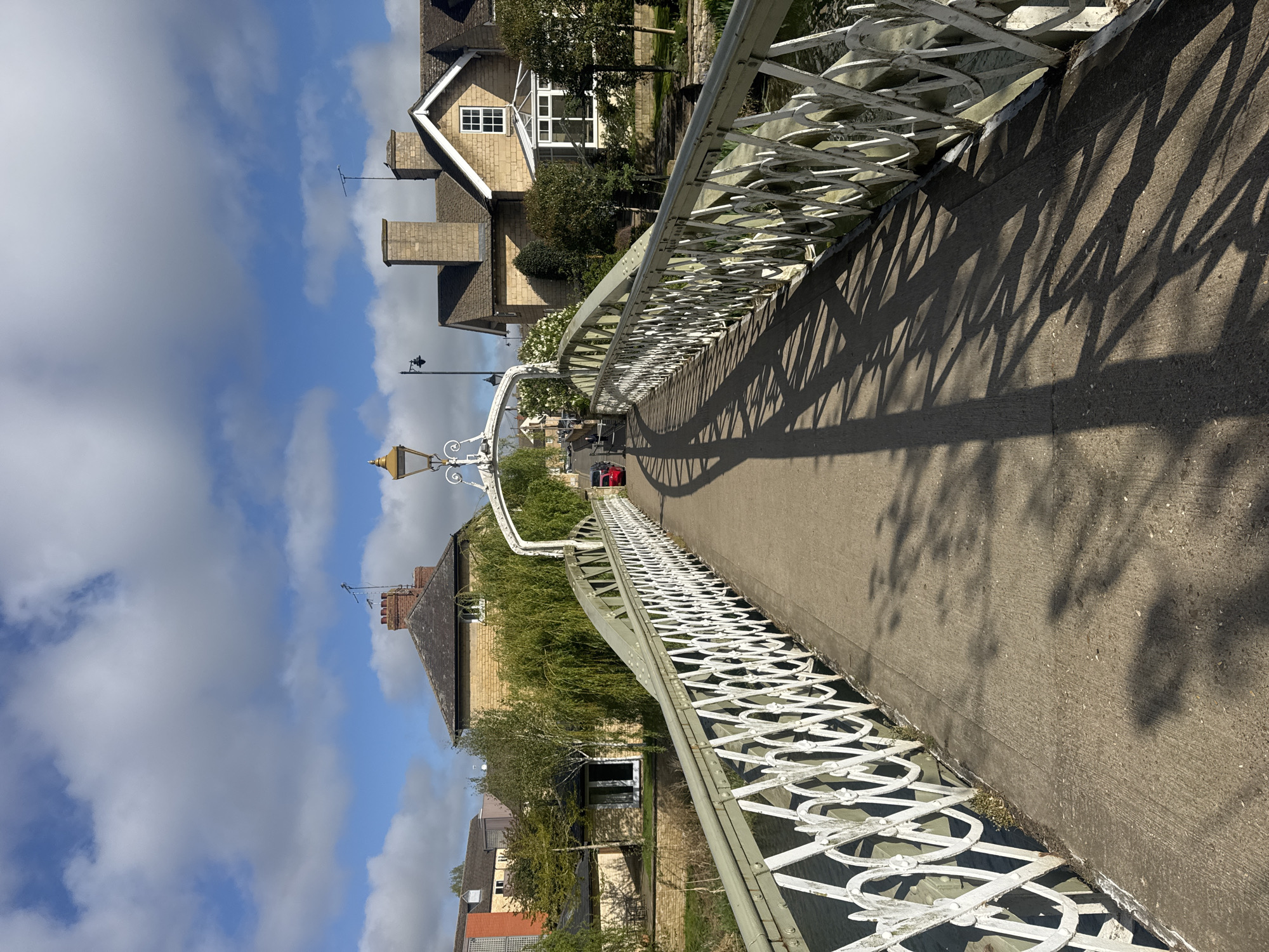 Sunlit pedestrian bridge photographed in South Kesteven, UK