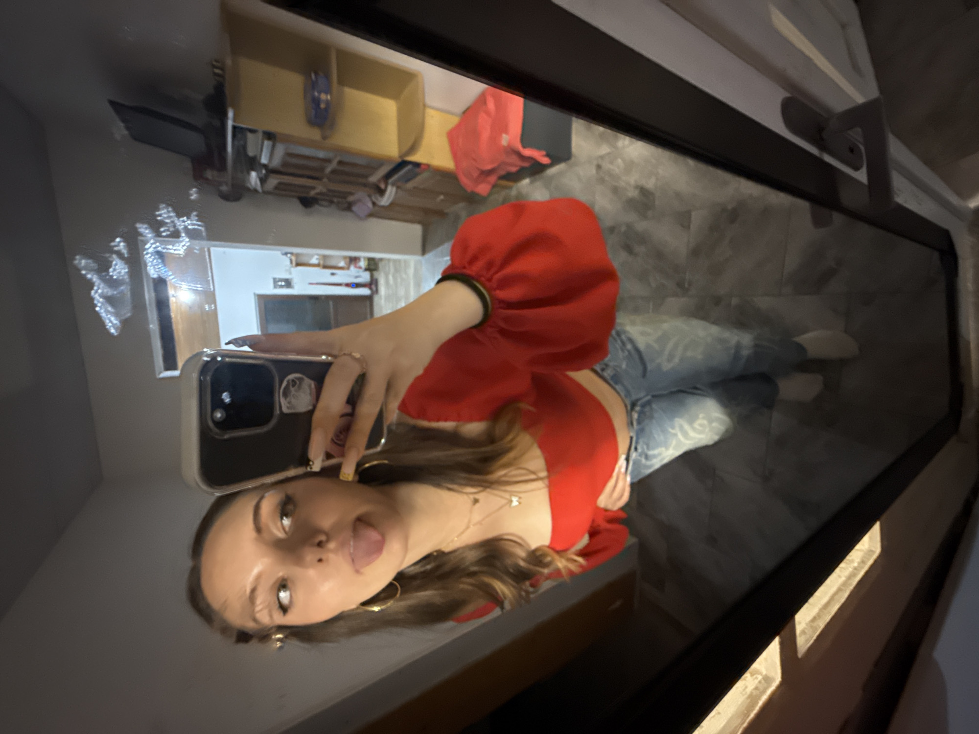 Young woman takes playful mirror selfies in Brashlen, Bulgaria