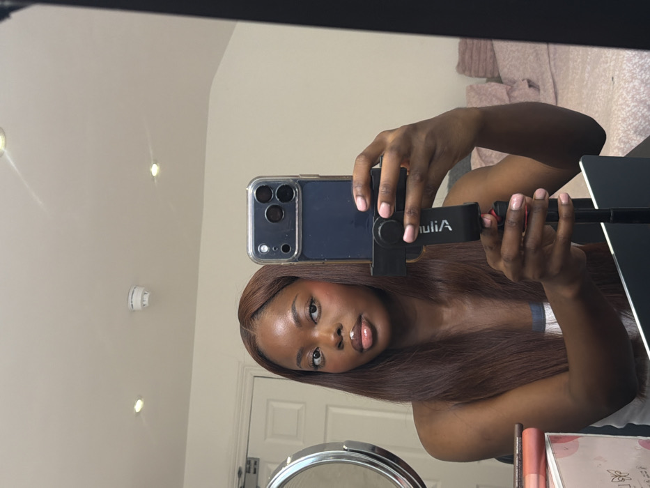 Woman takes mirror selfie indoors in Bristol