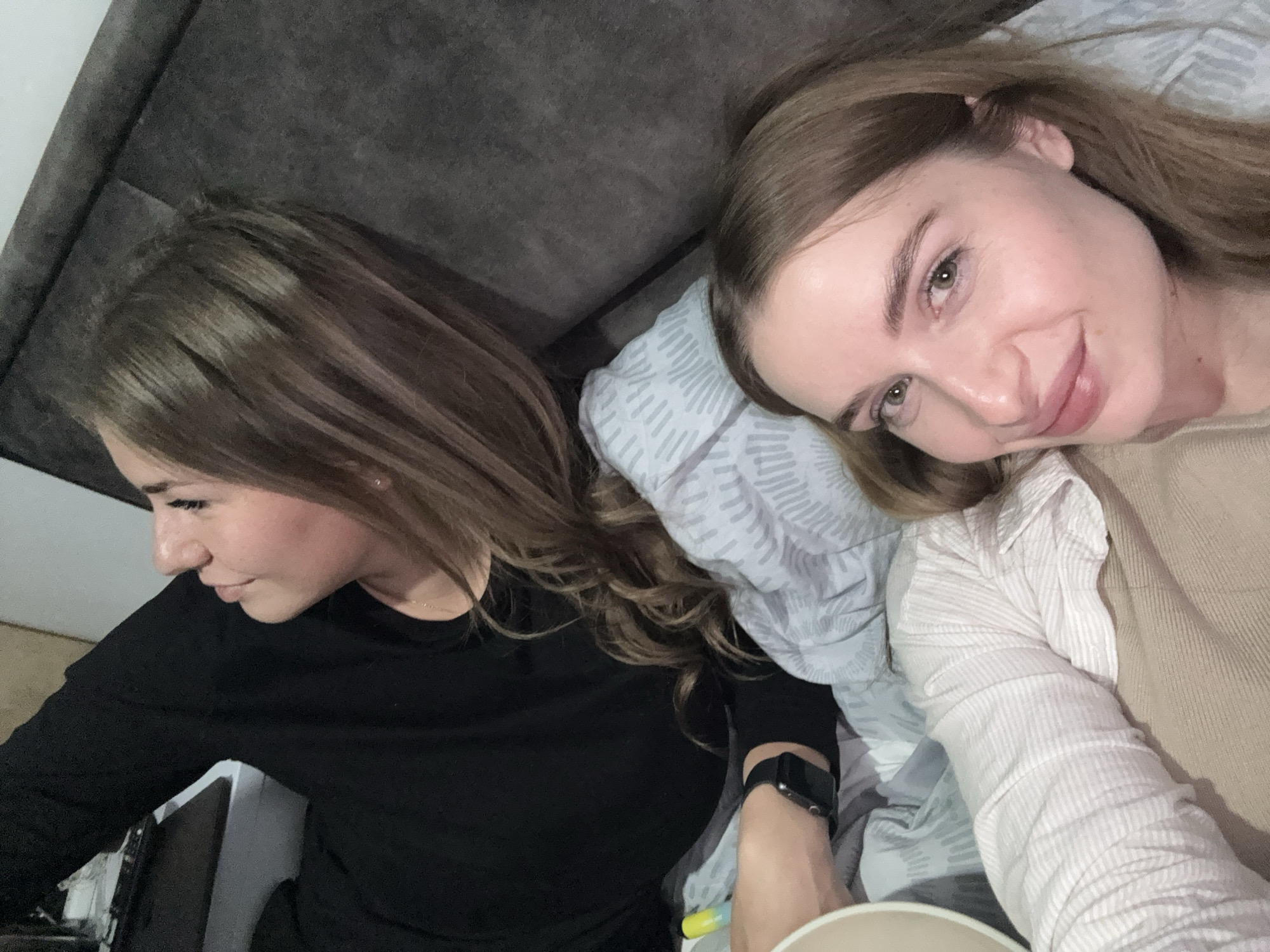 Two women share casual indoor moments in Budva