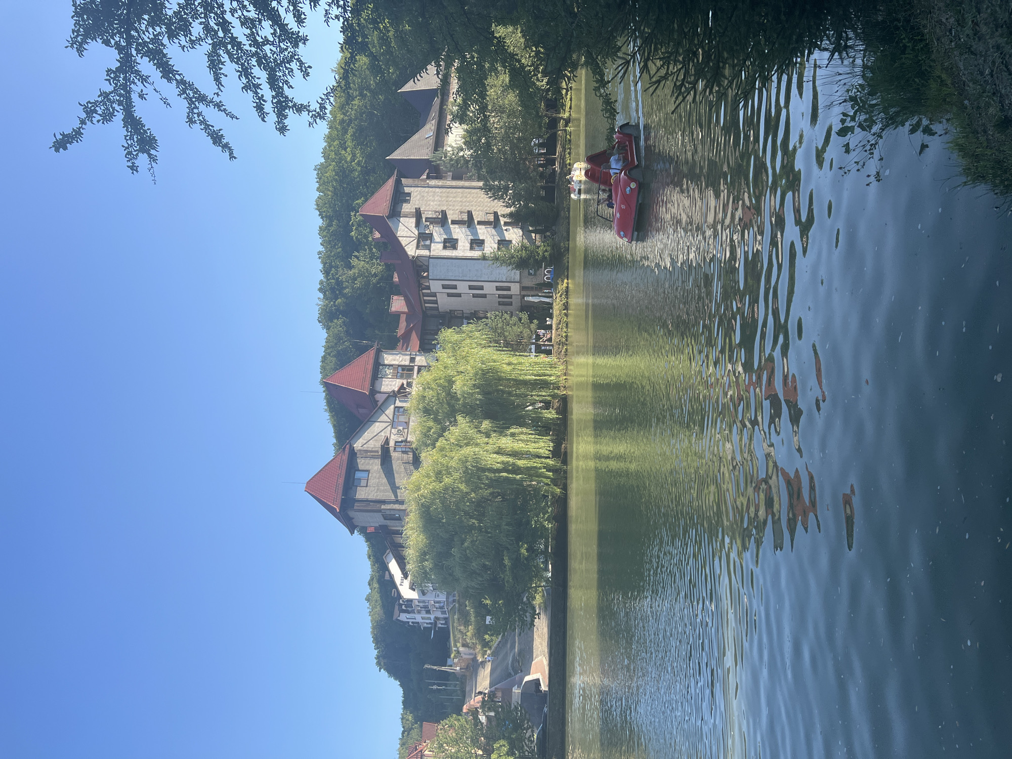 Pedal boats and lakeside resort on a calm Ukrainian summer day