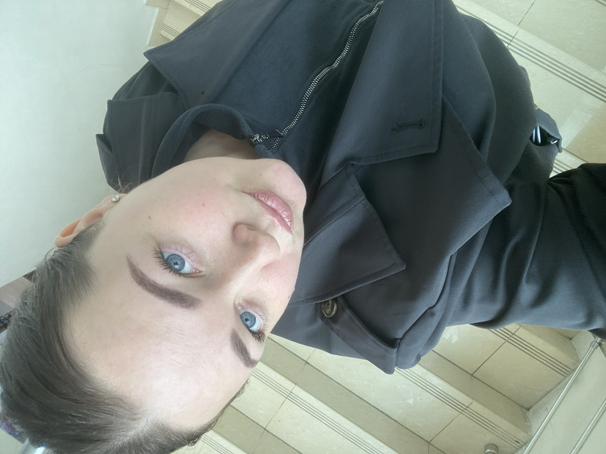 Woman photographed looking upward in Sochi, lime green background captured