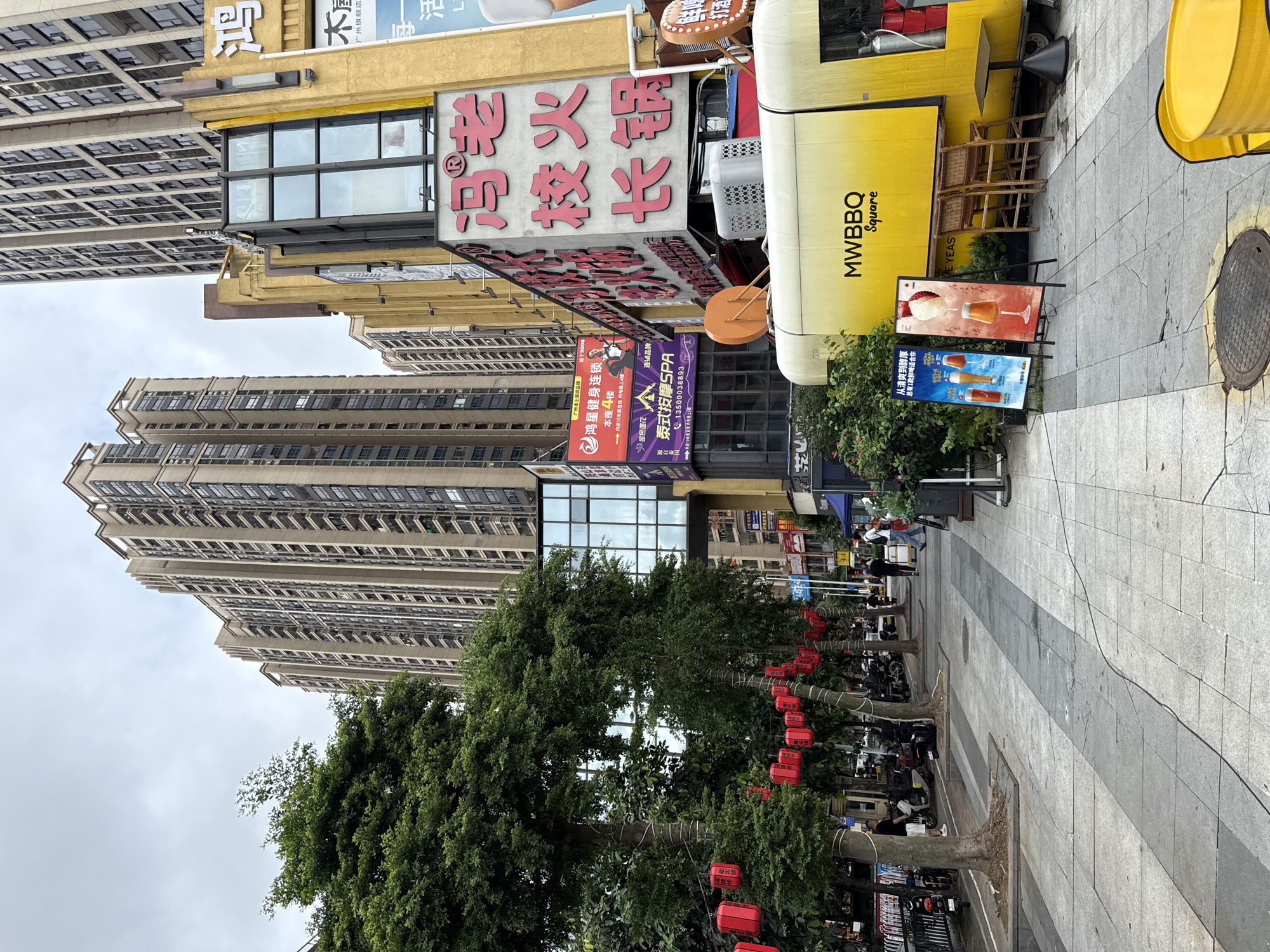 Haizhu District street strip with food vendors and outdoor dining