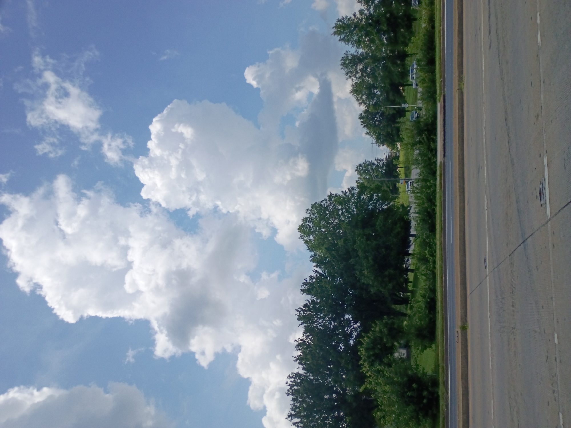 Open highway stretch near Lexington under a partly cloudy sky